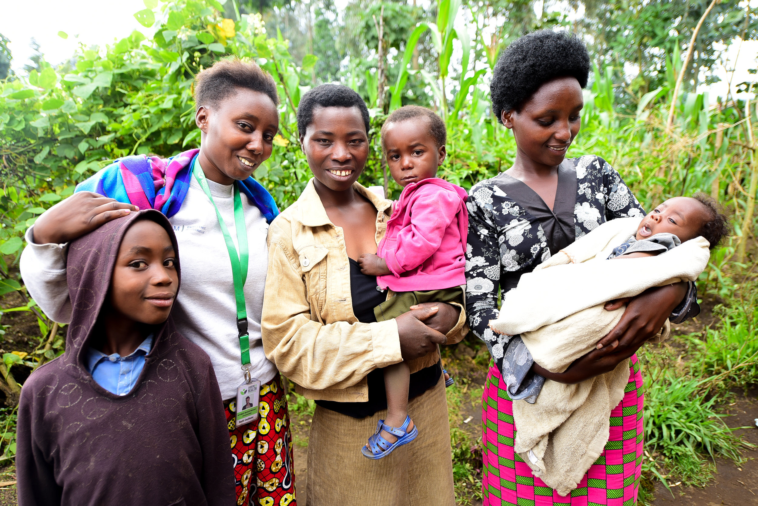 Beatrice with GHI Turi Kumwe representatives and her family.