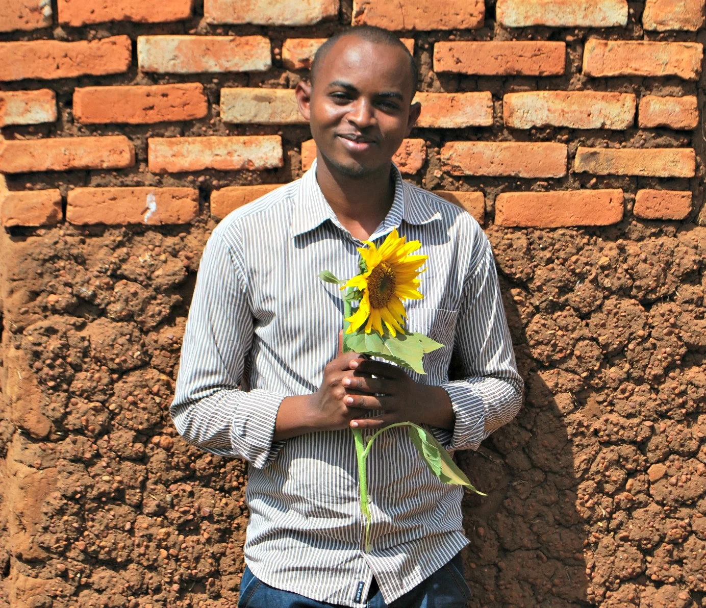 Godfrey, Agricultural Manager with seedlings.
