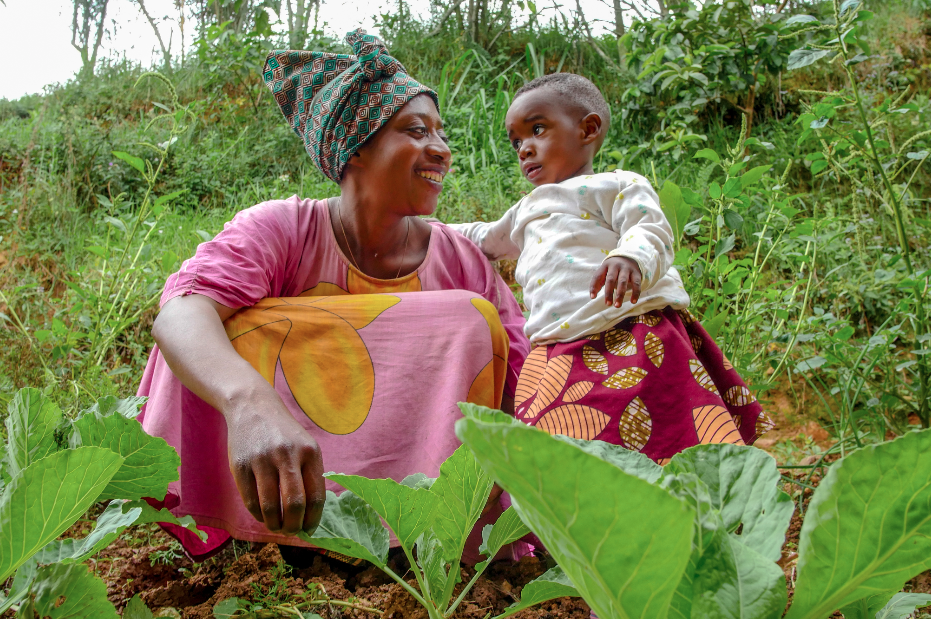 Marie Jeanne and Quevinne in their home garden.