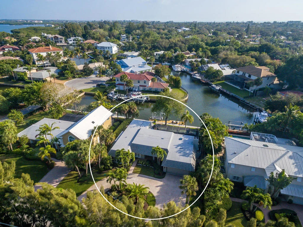 The aerial view of this home, situated on canal waters of Siesta Key.