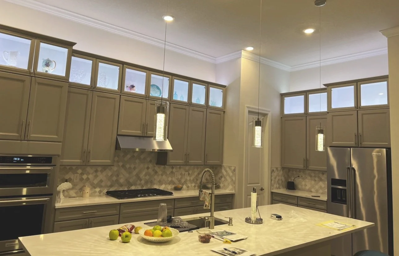  On this project I fabricated the boxes on top of the existing cabinets and matched the door profile and color so that they looked as if they were installed in the kitchen with the original cabinets. I installed the led lights on the floor of the cab