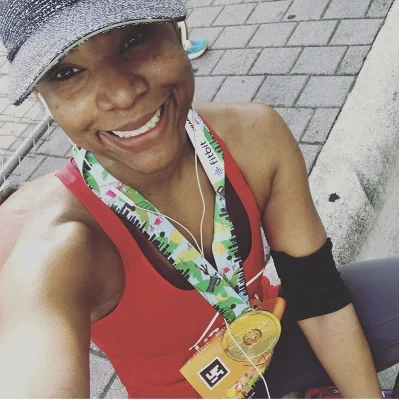Adrienne all smiles after the 2018 Miami Half Marathon in January.