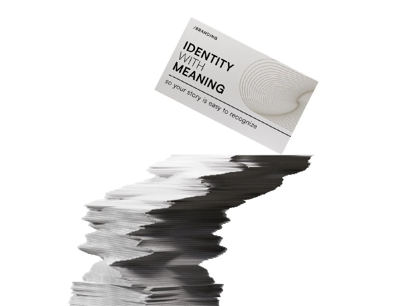 A stack of black and white business cards with one card slightly tilted, displaying the text "Branding: Identity with Meaning" and "so your story is easy to recognize" on a white background.