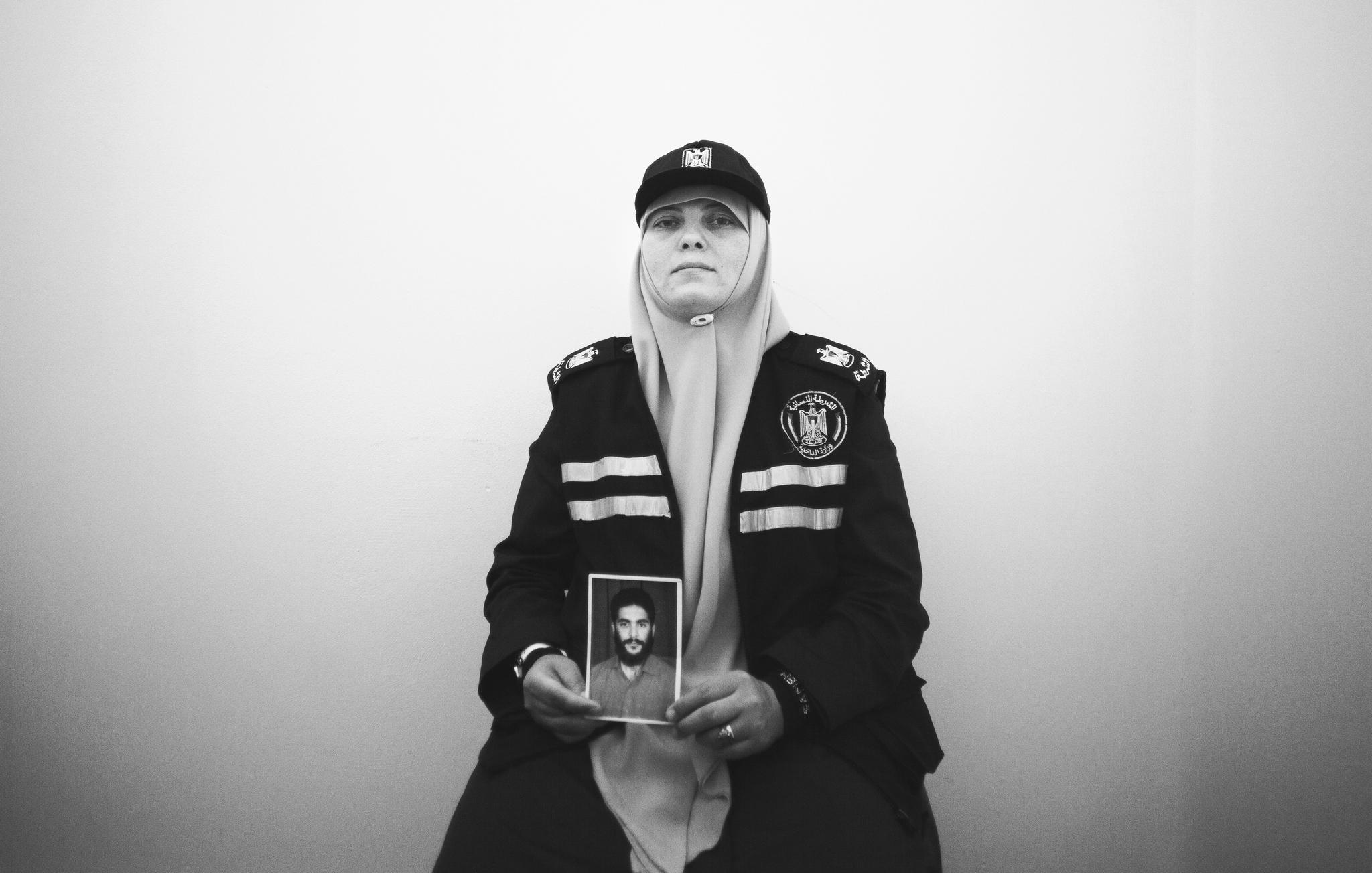 "My husband wasn't just a policeman, he is the love of my life, they might have killed him but he is still my hero" Lieutenant Mariam Albur Joined the Palestinian policewomen force after her husband was killed during the first war 2008-2009 while he was on duty as a police officer. Mohammed Albur was killed during an Israeli airstrike while evacuating civilians from under a collapsed building that was preciously targeted with an F16, his wife Mariam continues to work as a policewoman in Gaza, in hope to spread his message. © Images by Eman Mohammed | Broken Souvenirs series.