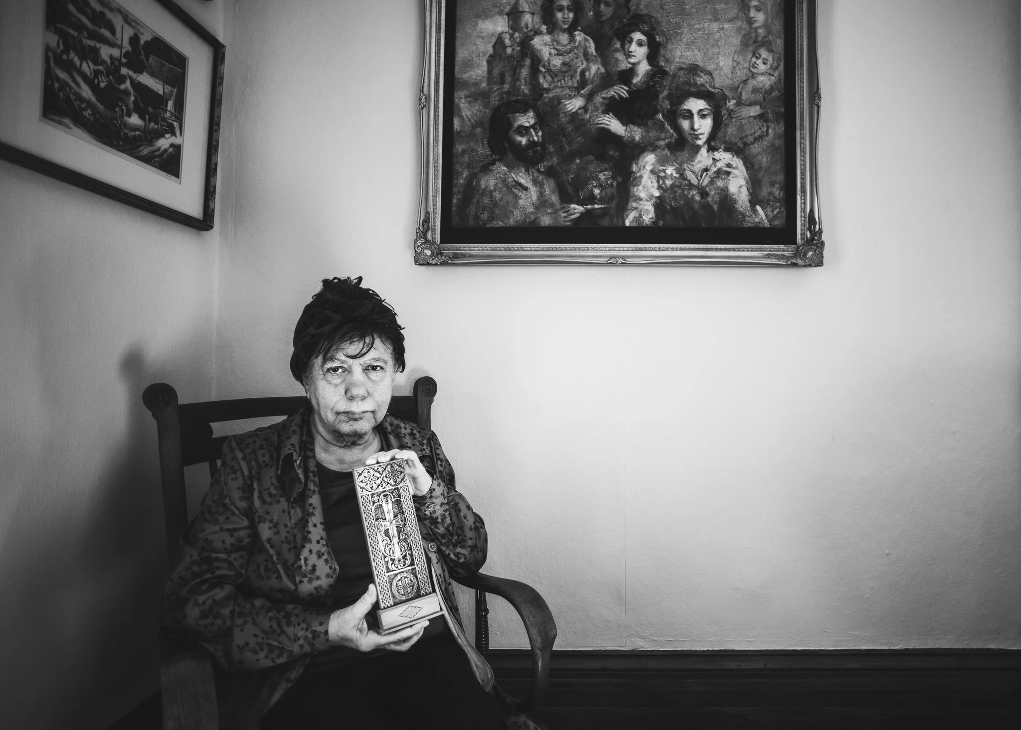 “We’re more connected to our history because we’ve watched those who survived breathe through the pain of losing their loved ones. All through life we’ve been trying to understand about this part of us, but never talk about it.” Third-generation Armenian Chris Rinck, whose grandparents emigrated to the United States, started collecting stories from older uncles and aunts as well as cousins who survived or witnessed the Armenian massacre being committed. She is holding onto documented materials in hope that the genocide will be officially recognized in history and the historical souvenirs of the survivors honored. In photo Rinck holds her great-uncle’s Armenian cross which he was killed for owning it. © Images by Eman Mohammed | Broken Souvenirs series.