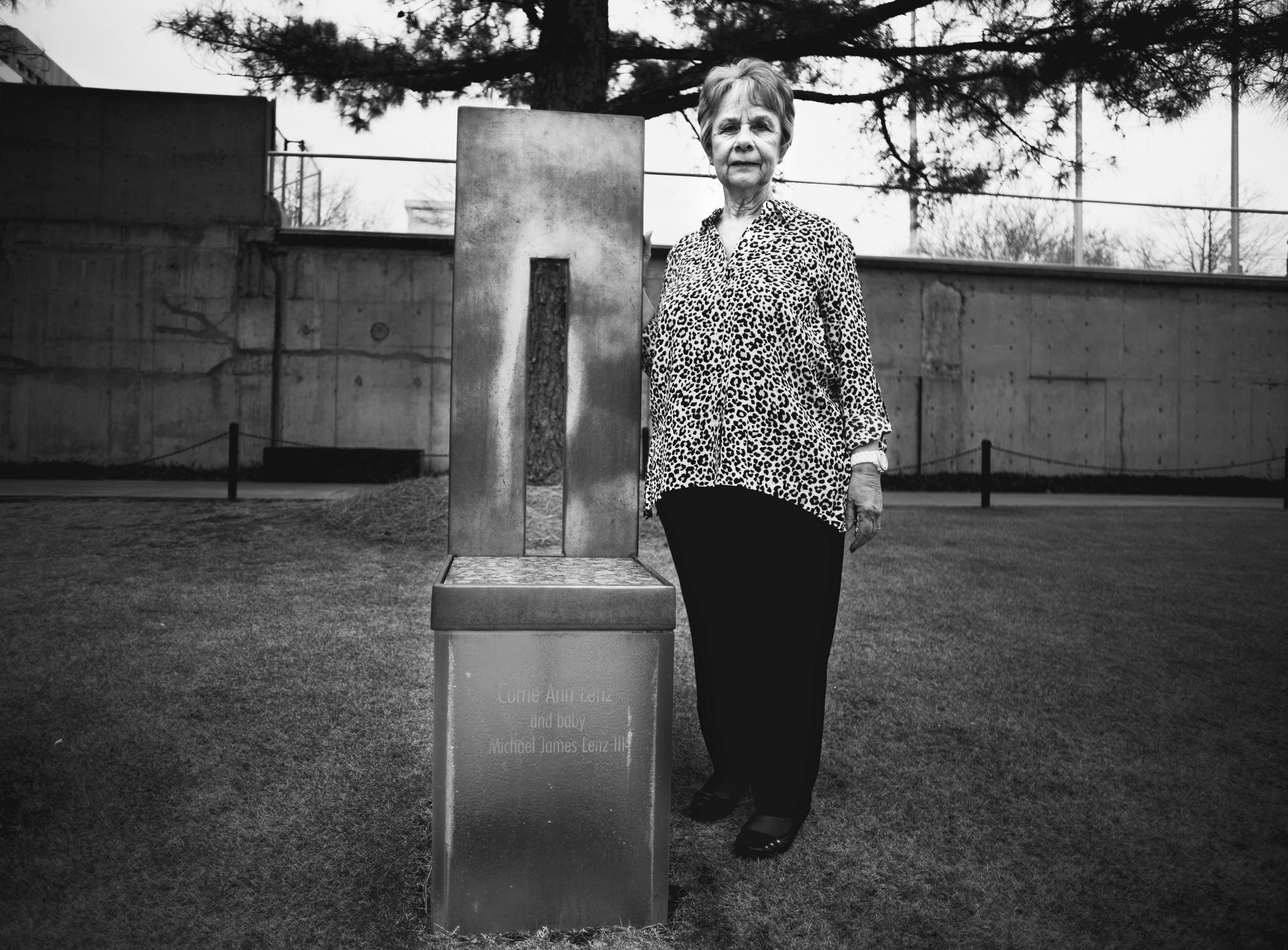 "My son in-law went to identify my daughter's body,she had brown long hair,but when he saw her it was dyed red from bleeding,I was in denial,thought she isn't Carrie, I never knew that while expecting for my first grandchild,I would lose both my daughter and her unborn child" Doris Jones, 64, standing next to her daughter's symbolic chair in the location where she got killed, Carrie Lynz was 26 years old and six months pregnant when a domestic terrorist attack targeted the Alfred P. Murrah Federal Building in Oklahoma City killing 168 and injuring more than 680 people, she was announced among the victims when her dead body was found the following day. © Images by Eman Mohammed | Broken Souvenirs series.