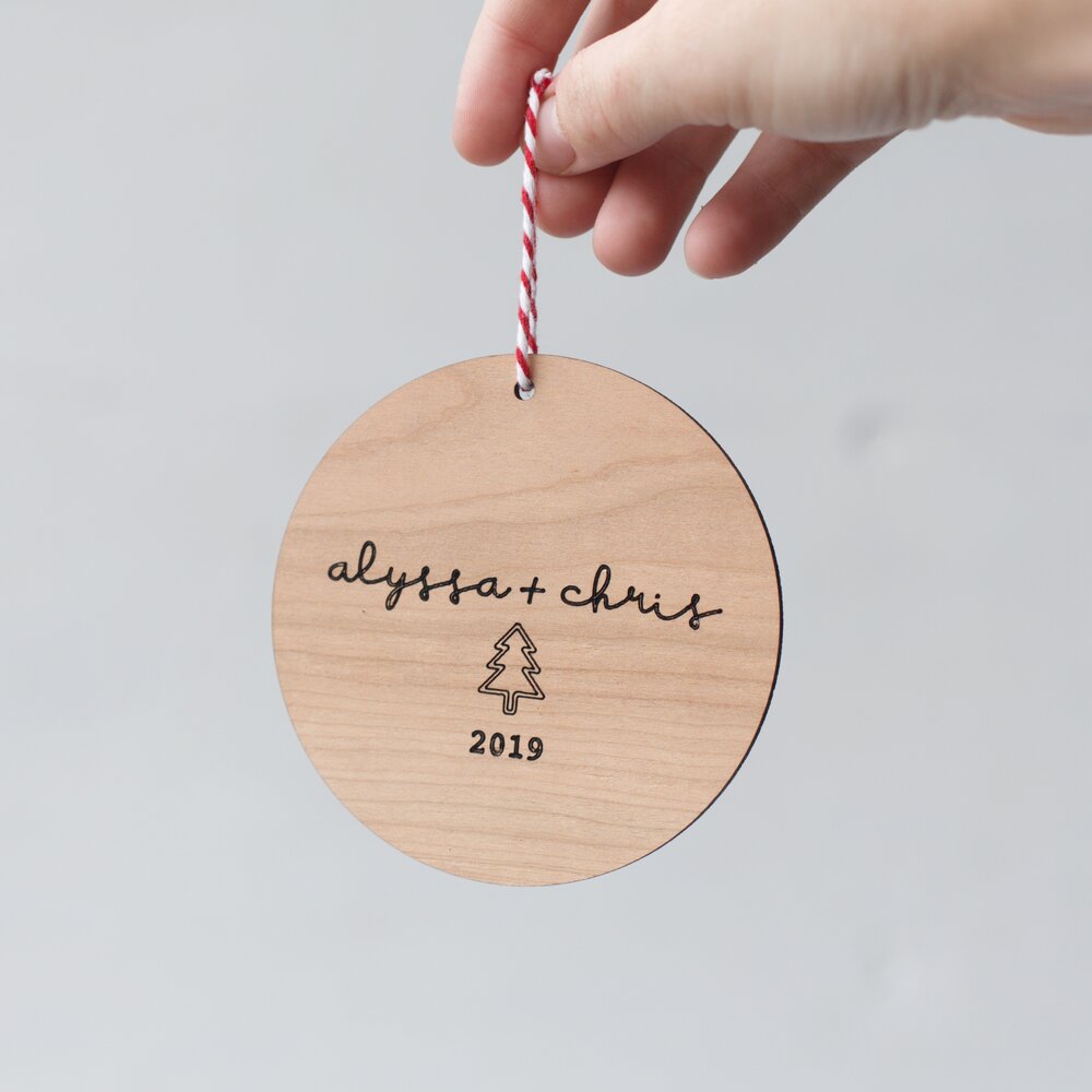 cut-scored-round-cherry-wood-christmas-ornament-couples-names-alyssa-and-chris-2019.jpg