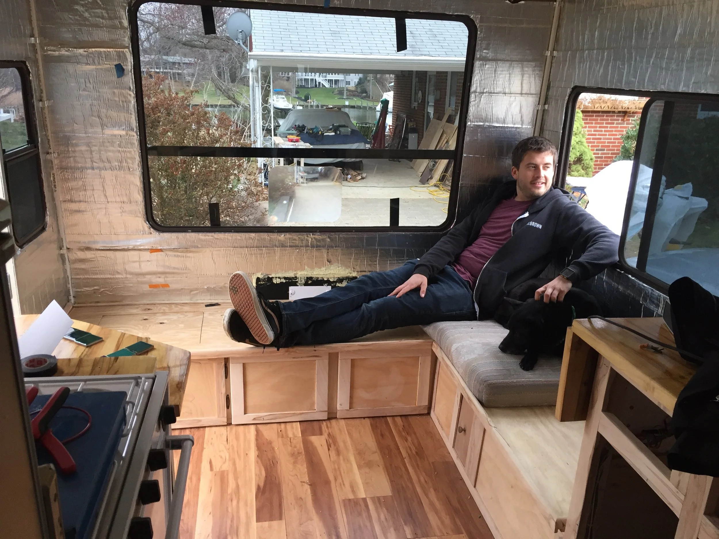 This is a photo of the couch after we installed our flooring and finished up the faces of the drawers and doors of the couch. But, this is the almost finished look.