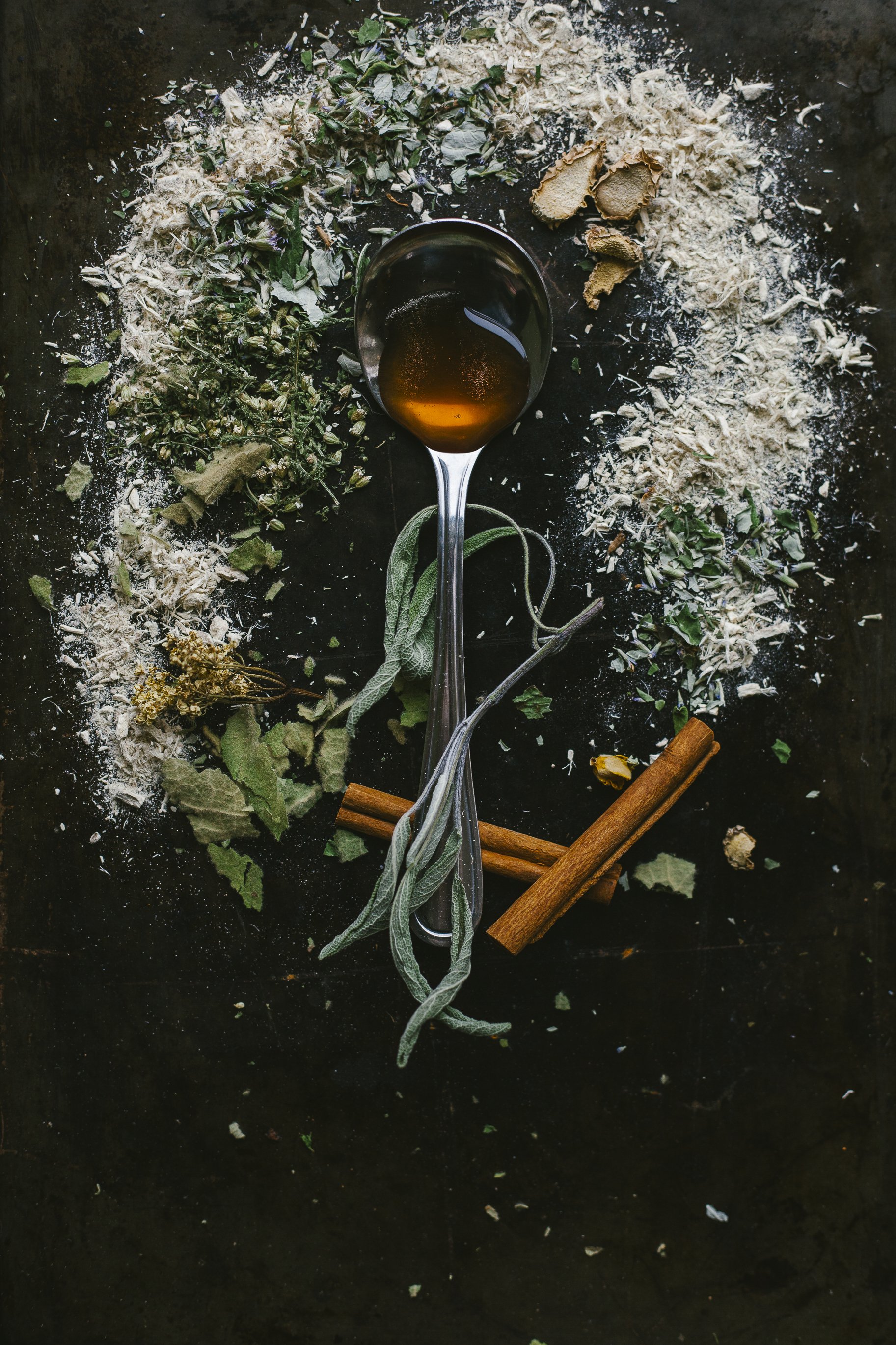 Boost your immune system and soothe your throat with this homemade herbal cough syrup, featuring a powerful blend of elderberries, mullein, marshmallow root, yarrow, sage, elderflower, hyssop, ginger, and cinnamon