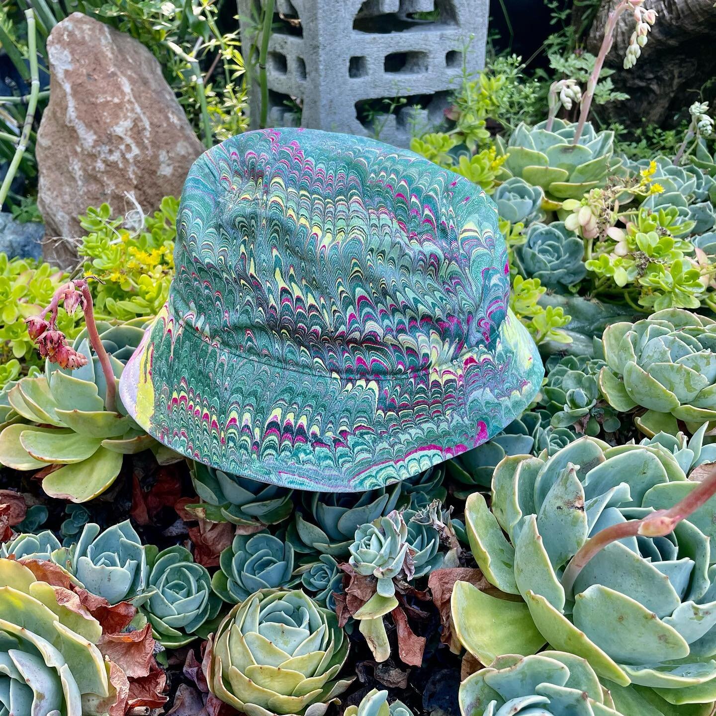 Top off your 😎🍉summer🧴🌻look 👀 with my fresh Marble Dipped Bucket Hats! All one of a kind every time!! 

Dom Chi Designs is OPEN 11-5pm Thursday-Sunday. 

#domchi #marbled #summer #buckethat #oneofakindeverytime #custombuckethat