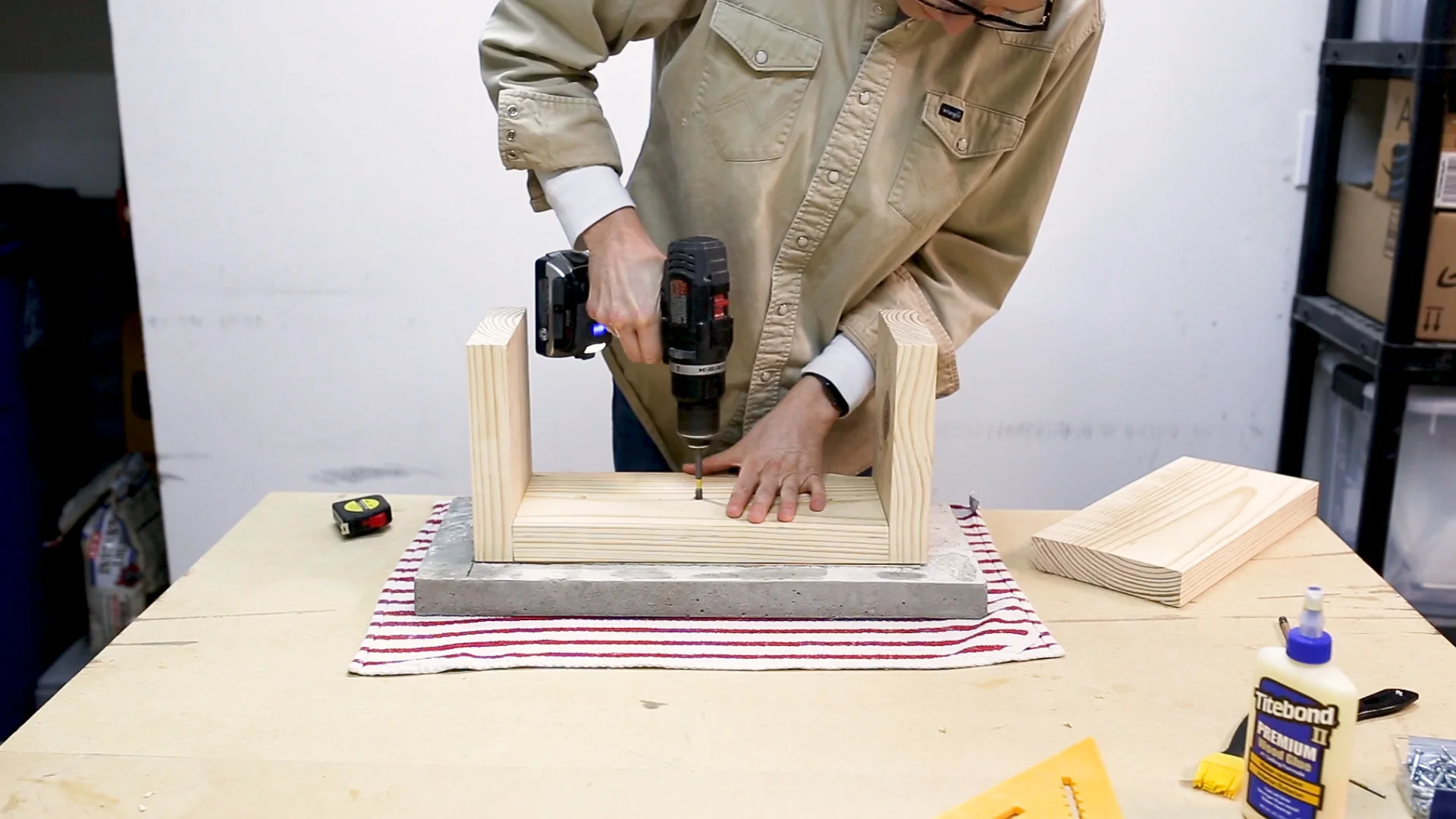 Once the sides were attached, I attached the base to the concrete top. I drilled recesses and screwed the base into the board in the concrete.