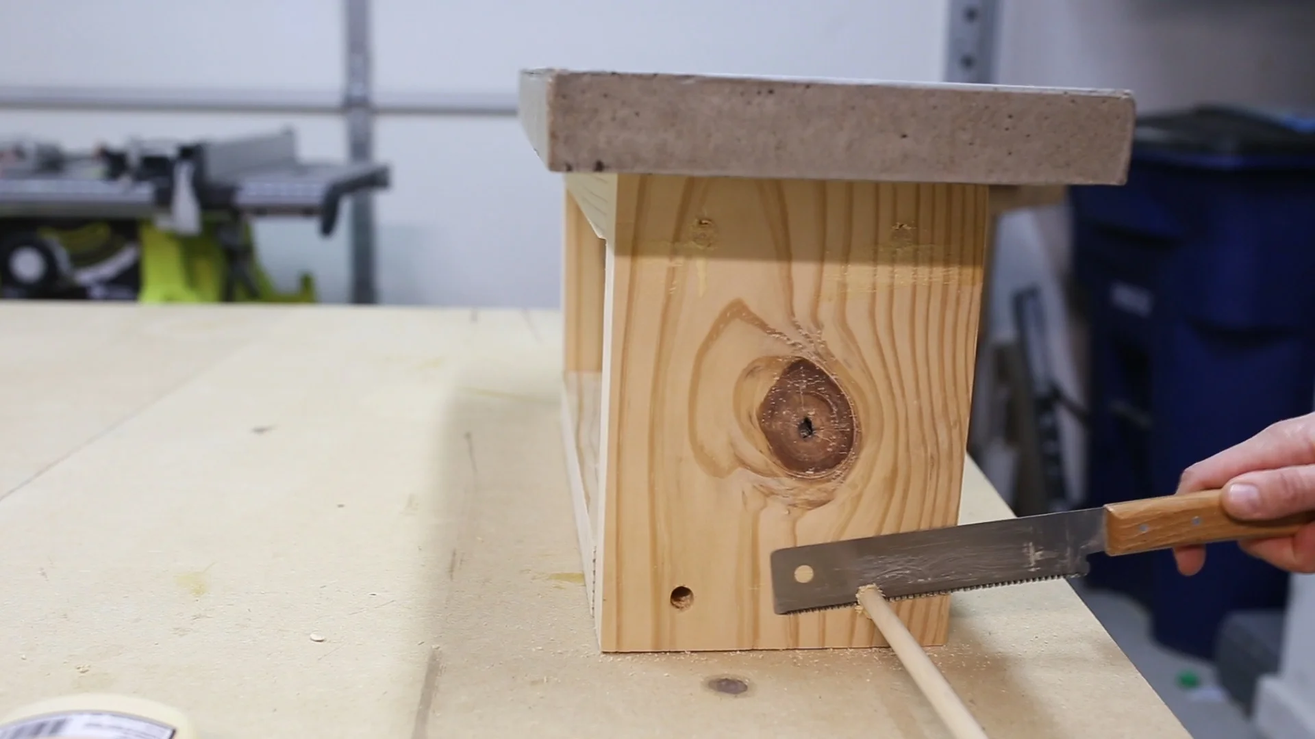 To cover the recessed screws, I used dowels. I applied glue to the end of a dowel, stuck them in the screw holes and then cut the dowels off with my flush trim saw.