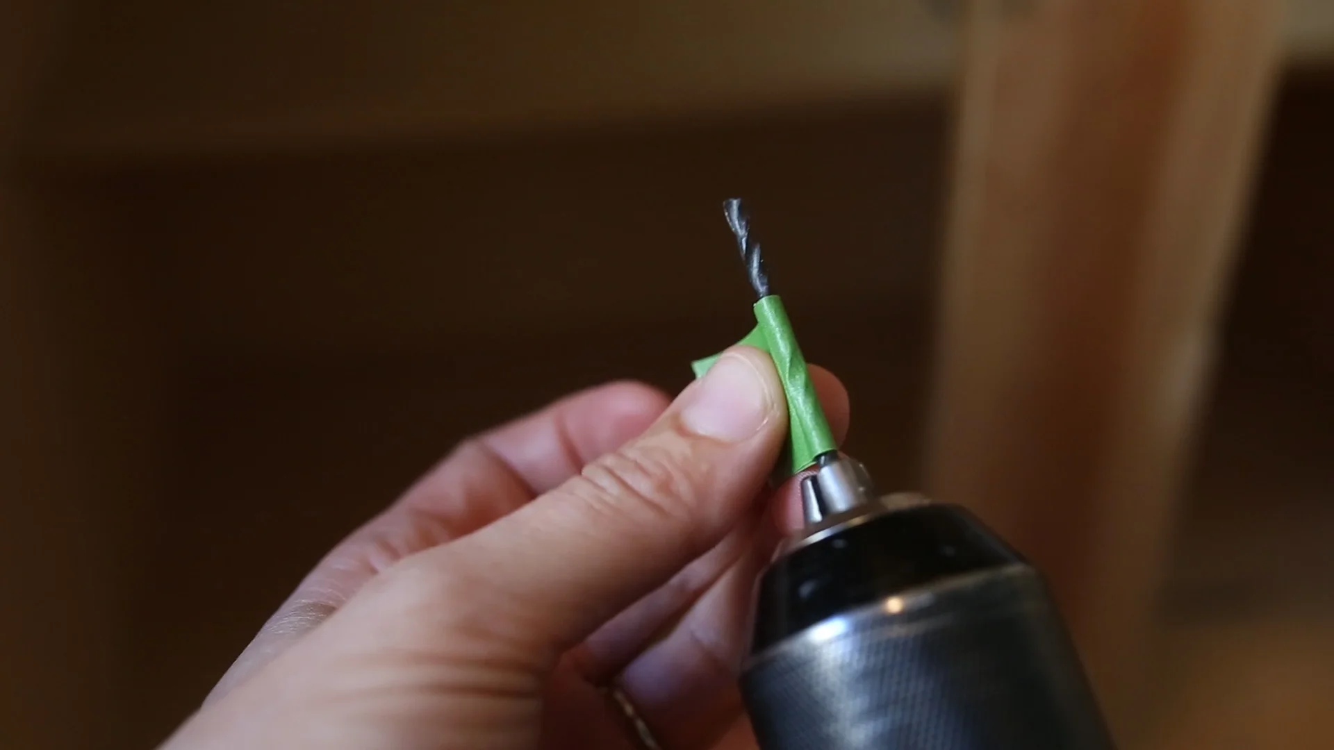 To make sure I didn't cut too deep, I used painters tape to make a depth guide on my drill bit.
