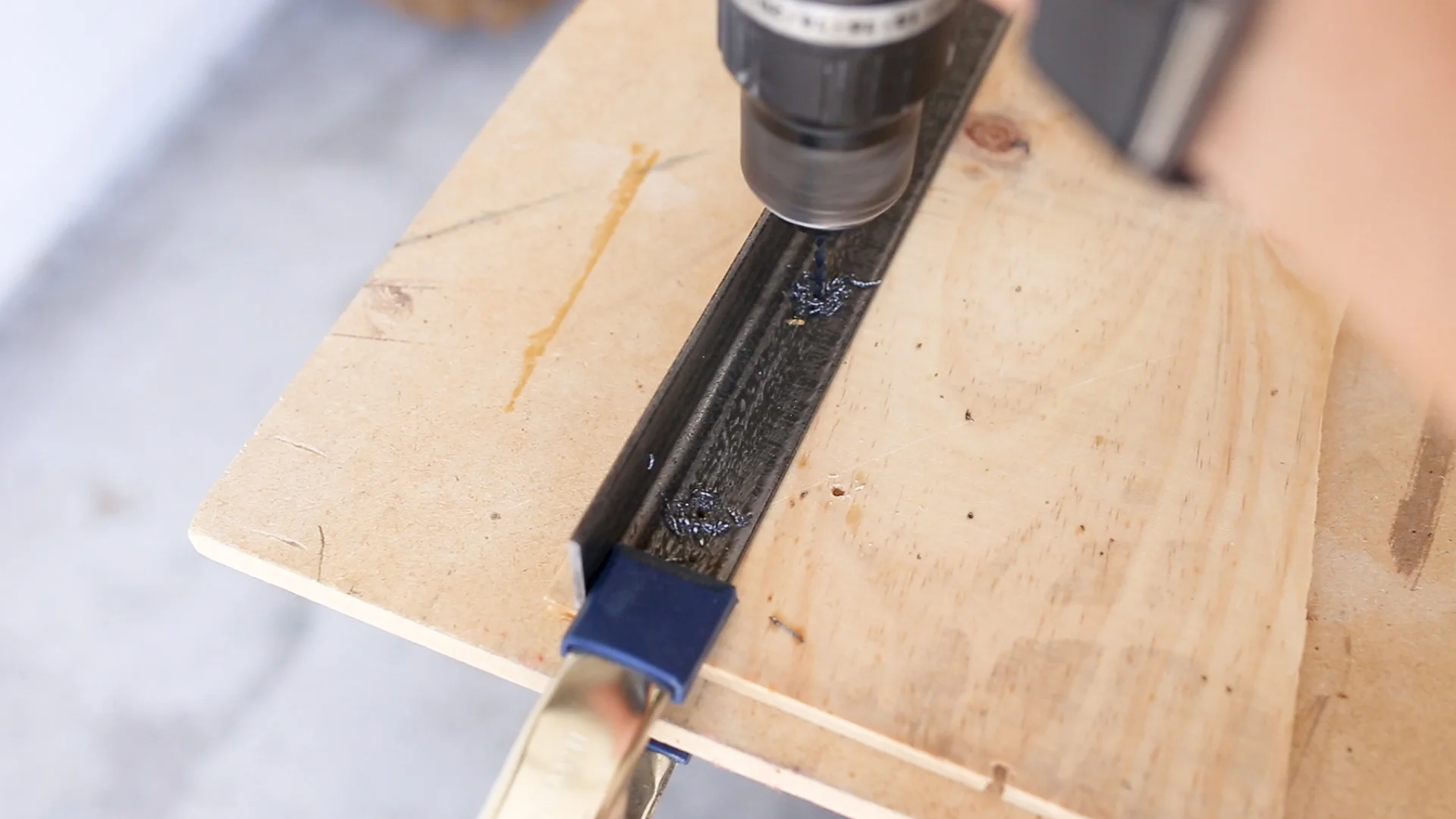 To attach the wood to the metal, I used screws. To drill the holes in the metal I used cutting oil and Black Oxide Drill Bits and drilled two holes per end.
