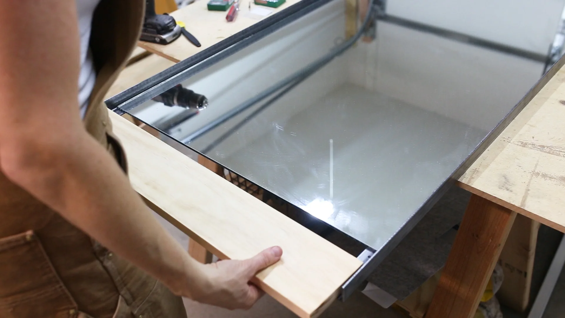 Next I could attach the bottom board, again placing the mirror on the dado to hold it in place.