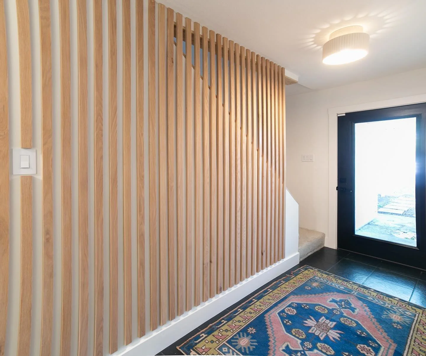 The stairway slat wall project is complete!! Every time I walk past it my face looks like this &mdash;> 😍The stairwell is lighter, brighter, and the whole wall is such an upgrade.

Check out the full project on my YouTube channel, from demo&rsquo