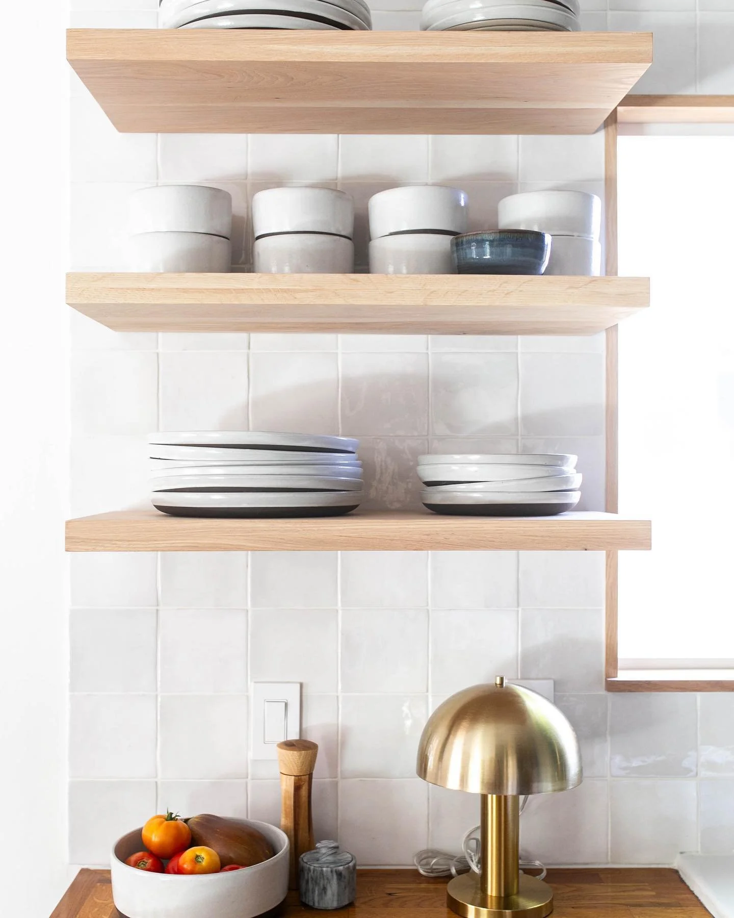 I&rsquo;m so glad that I decided to add the hidden floating shelf hardware to the wall studs before tiling the kitchen wall! I&rsquo;m slightly obsessed with these solid white oak shelves against this tile (and especially next to the blue cabinets 💙