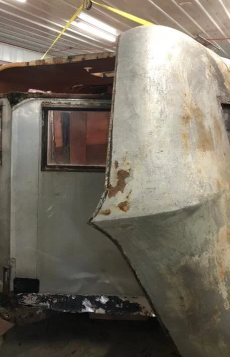 The original formed metal roof needed some work before preparing for paint