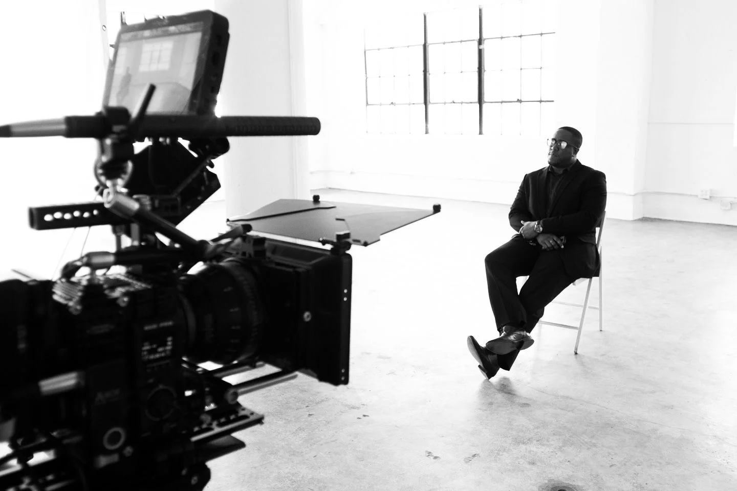 Colin C. K. Njemanze directing on set, standing in for talent