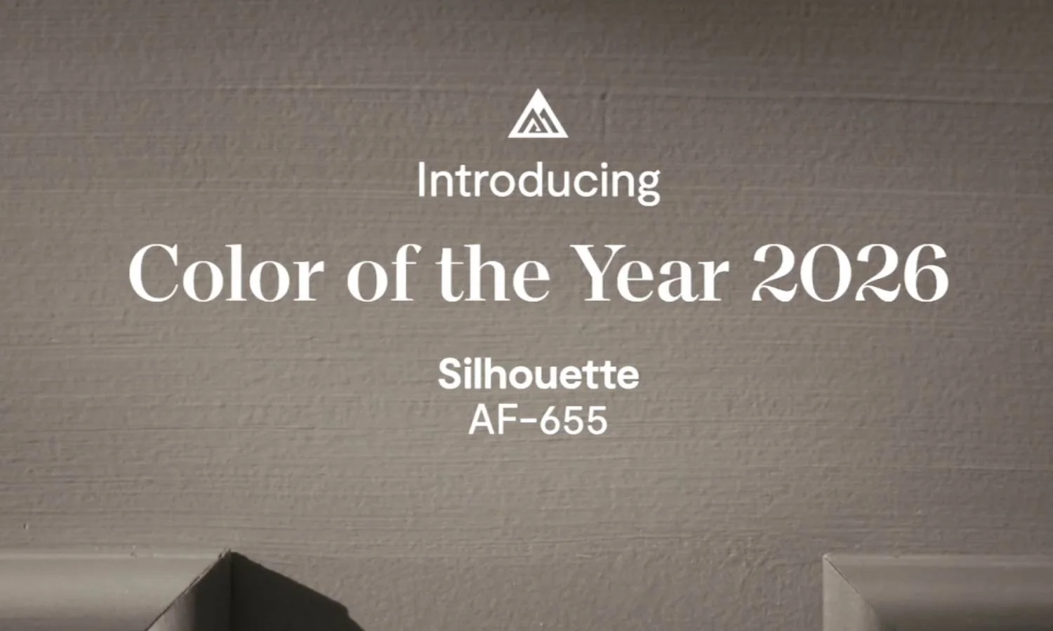 Image announcing the Benjamin Moore Color of the Year 2026, Silhouette AF-655, on a wall