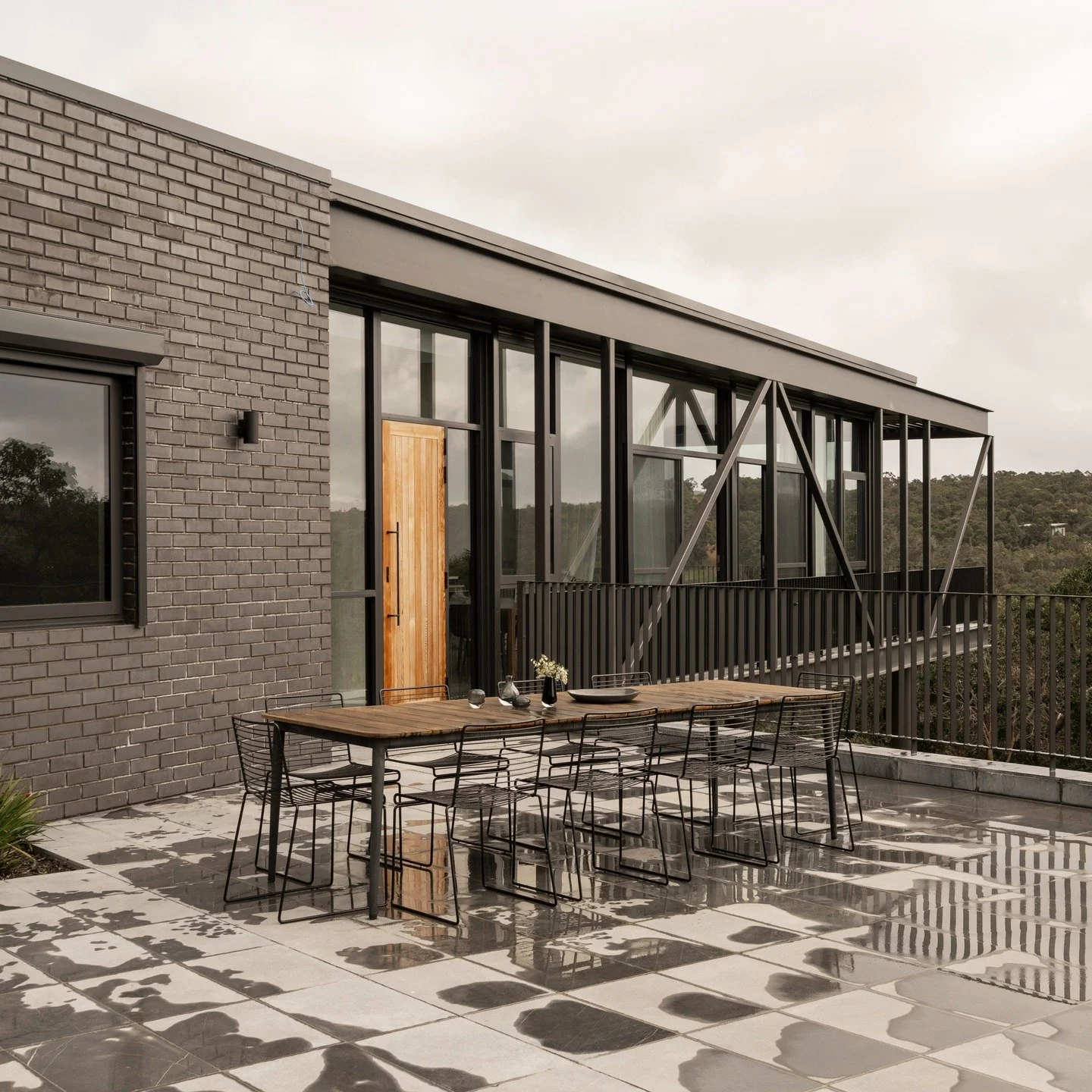 Eagle Bay Residence. 
Light-filled living with coastal views, bedrooms tucked away for quiet retreat.
A custom spiral staircase adds a touch of elegance, while warm, simple materials make the home feel relaxed and inviting. Designed for comfort, styl