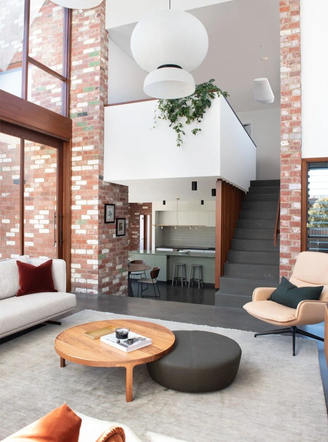 Phoon Residence. Light pulls you into the kitchen and dining &mdash; the heart of the home. Recycled brick, cool concrete and warm timber set the tone, centred around a sculptural stone island made for everyday rituals and shared moments.

architectu