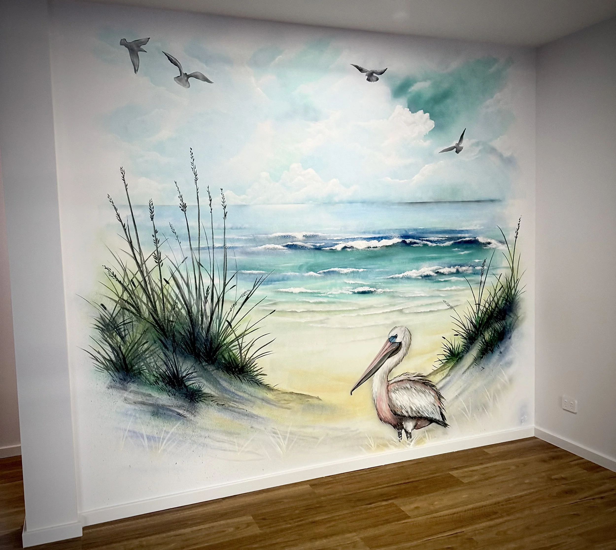 Washed out Mural of Beach, Pelican and seagulls in lounge room of private residence in Port Macquarie.