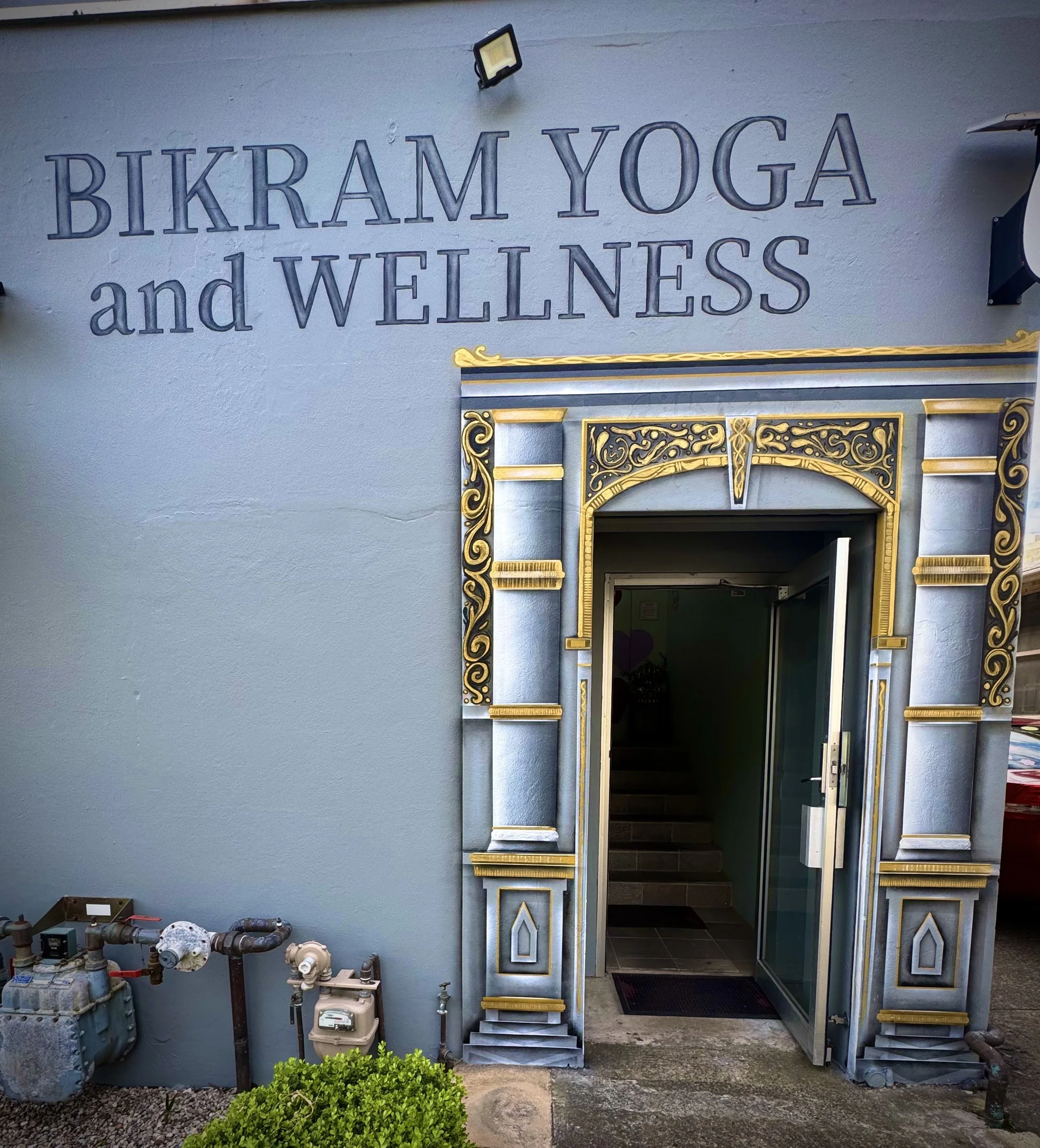 Temple entrance mural and hand painted signage for BIKRAM Yoga and wellness located in Brookvale on the Northern Beaches.