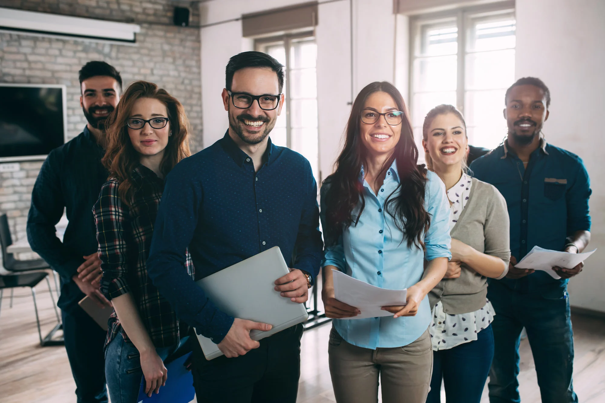 smiling employees of Ingage Inc act as consultants for small businesses that are ready to move to a bigger office.jpg