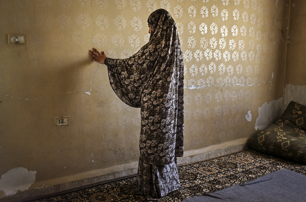  KILL ME INSTEAD!

Fadia, 19, traces cracks in the walls of her rented apartment as she describes the death of her father. After returning home from his job as a construction laborer, shortly before the dawn prayer, he collapsed right away onto his b