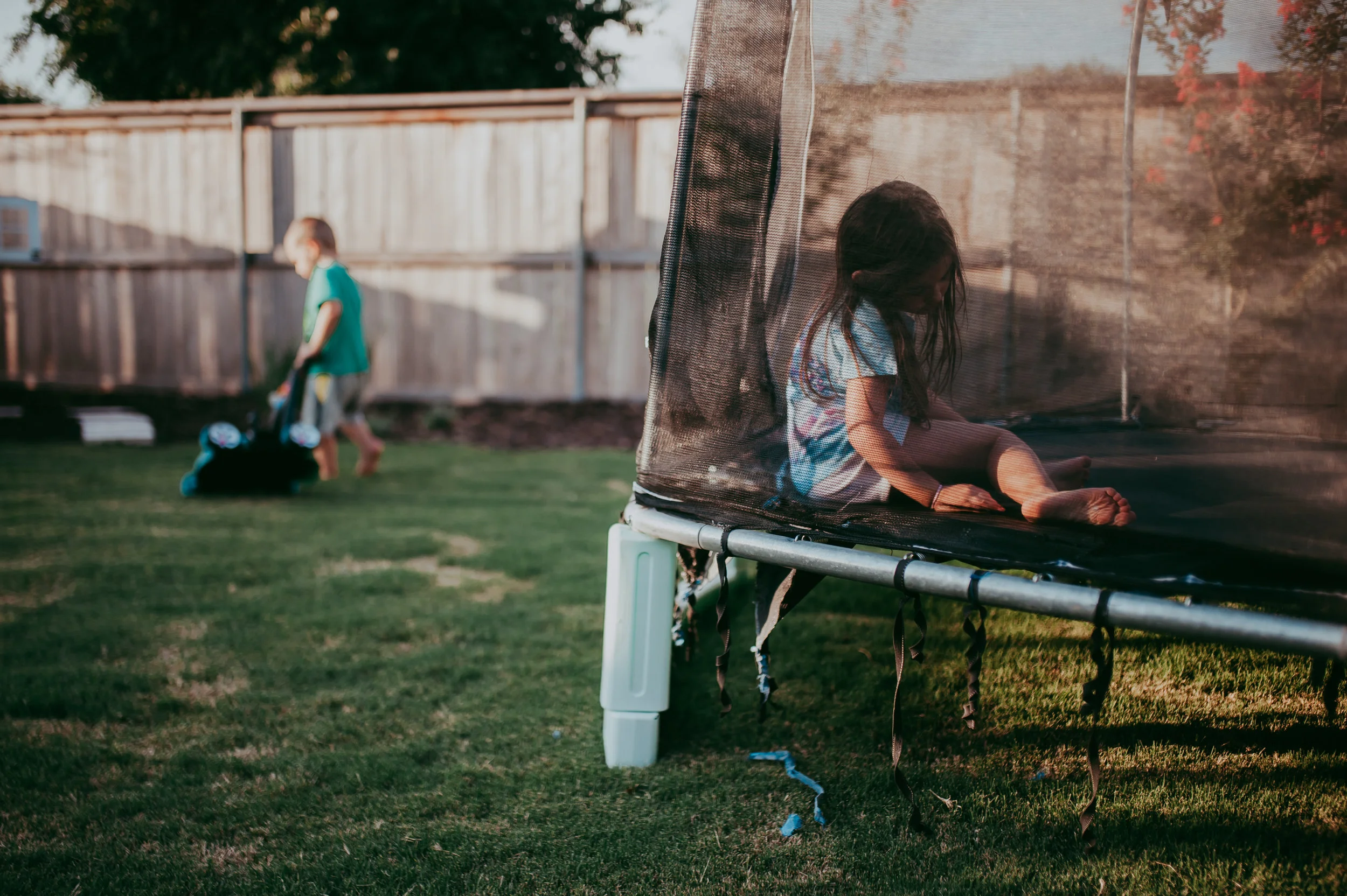 This is what I first saw when I grabbed my camera. Light coming into the area of the trampoline. This okay I guess, but not the awesome summer evening vibe I was going for.