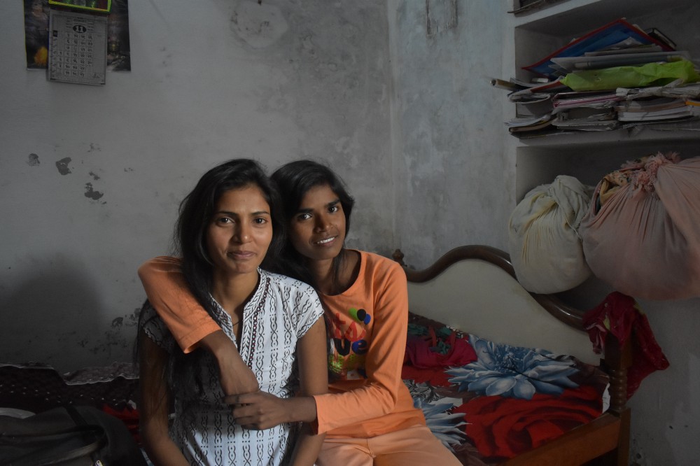 Rani poses with her sister Pooja in their shared bedroom. (Courtesy of Bhumika Regmi / Malala Fund)