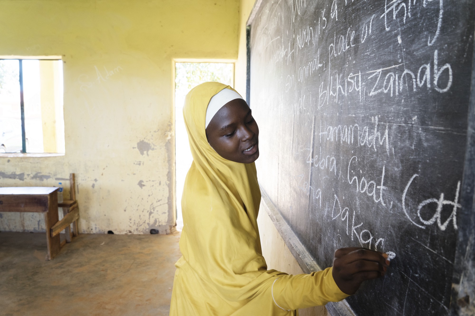 Amina in a classroom in Nigeria. (Courtesy of HUMAN / Malala Fund)