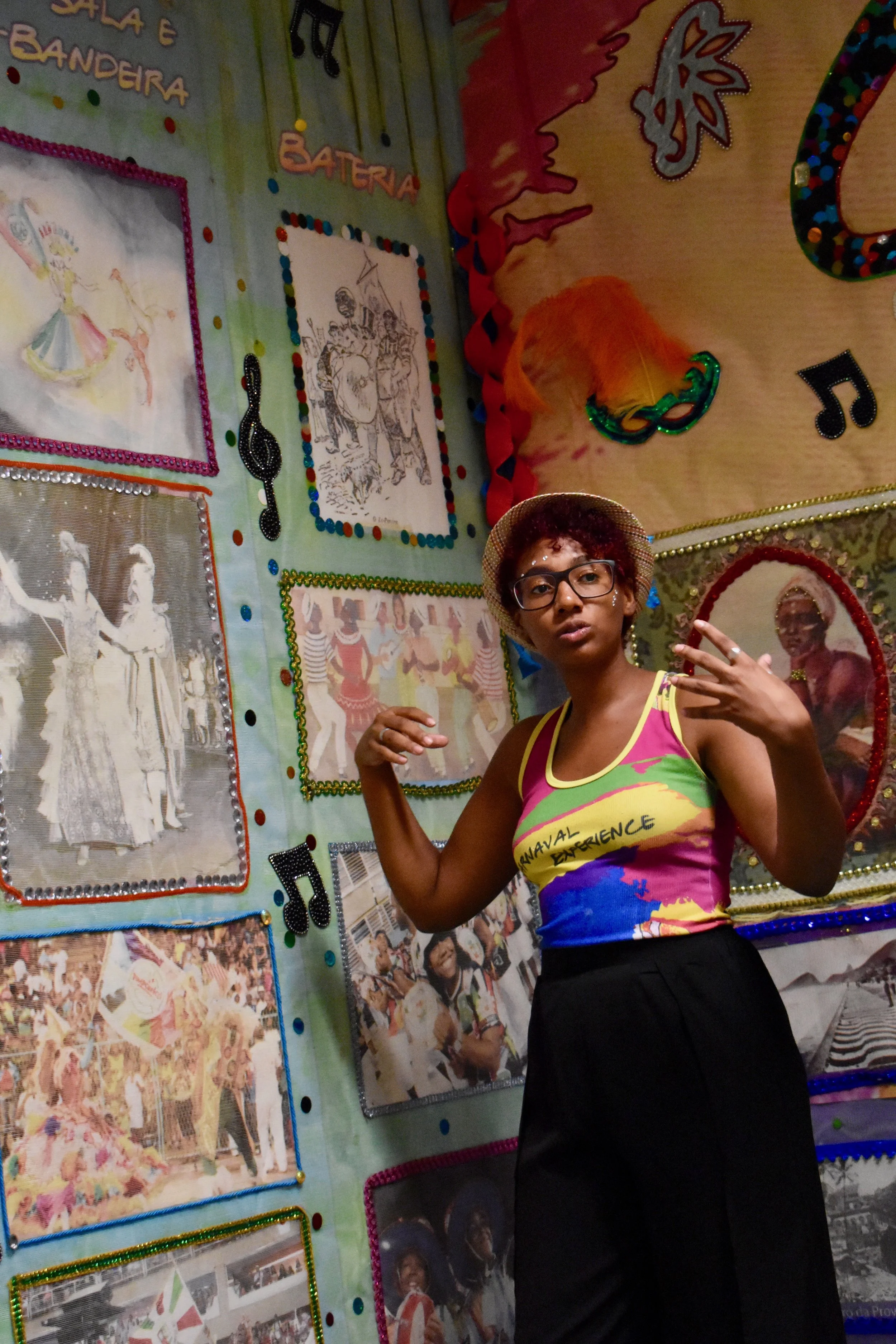 Dondara explaining the history of carnival during a tour of Grande Rio Samba School. (Courtesy of Tess Thomas / Malala Fund)