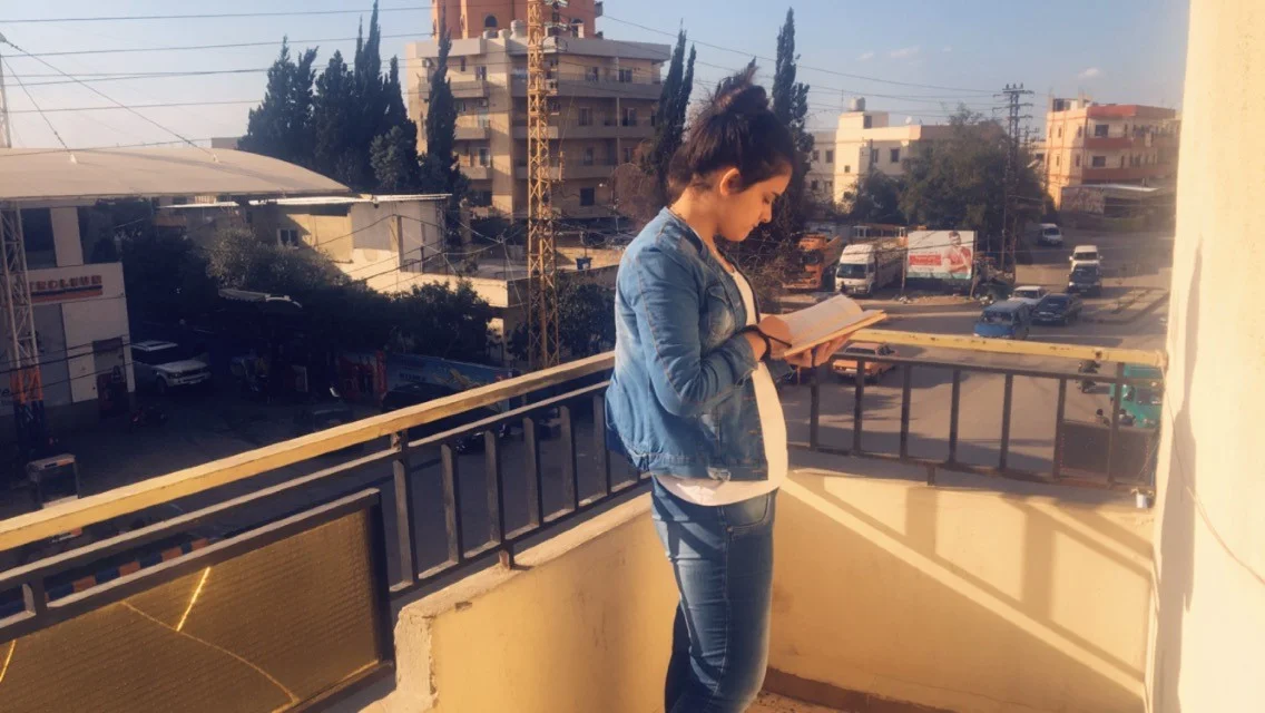 Reading at the Naba’a office. (Courtesy of Huda)