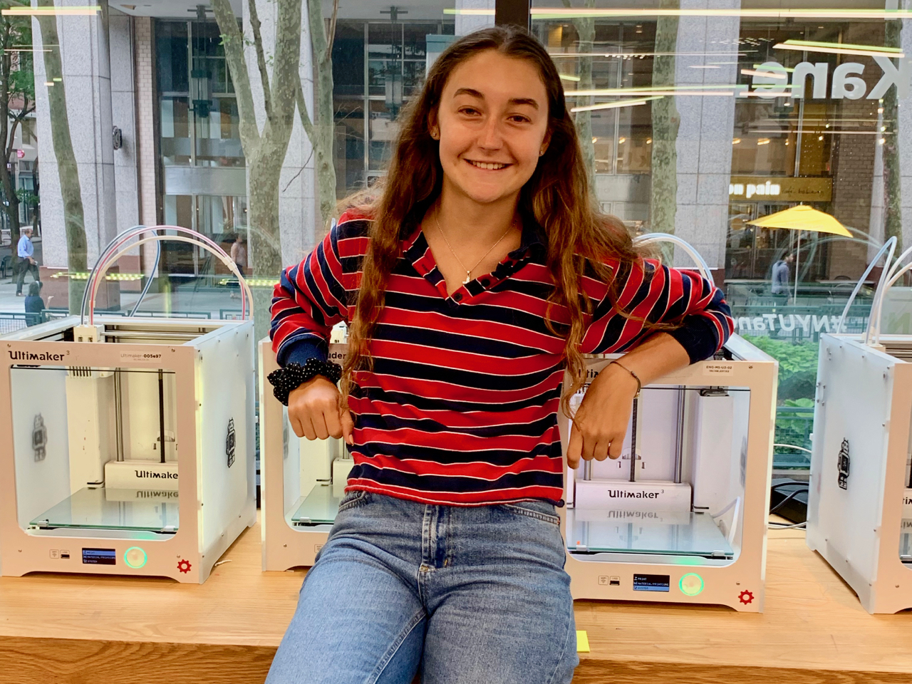 Karina Popovich poses with 3D printers. (Courtesy of Karina Popovich)