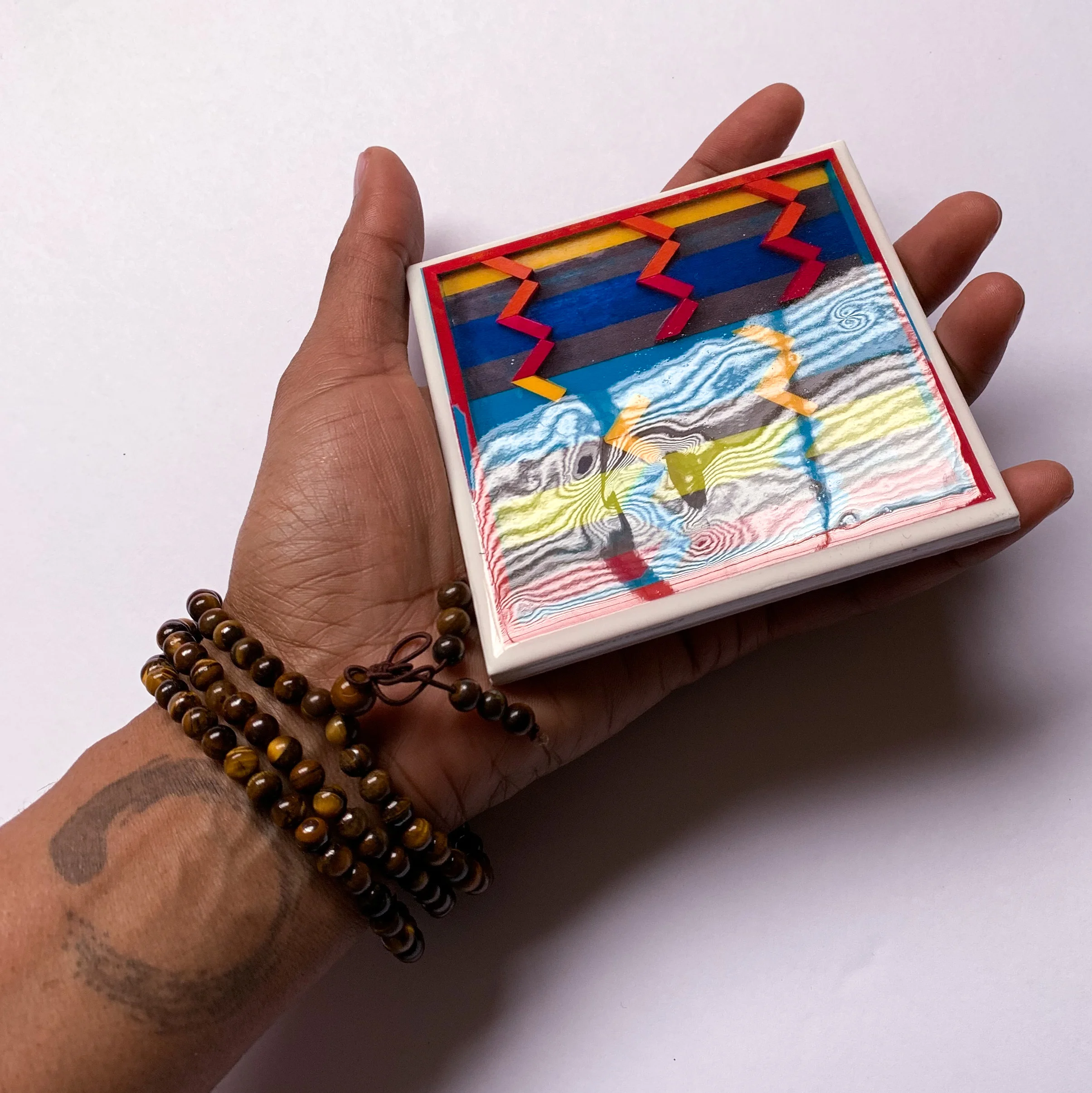 Geometric-Abacus handheld glare.jpg