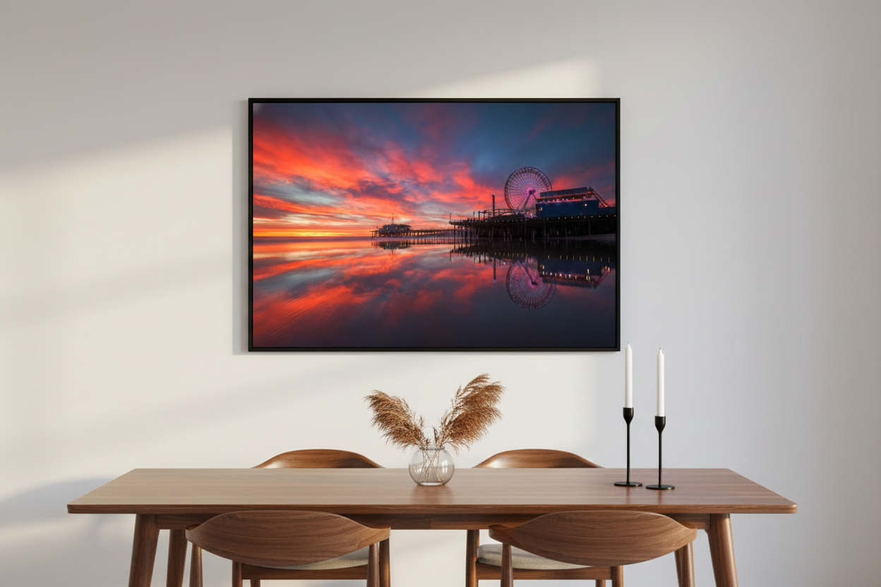 Santa Monica sunset wall art in a black float frame in a sleek penthouse dining room.
