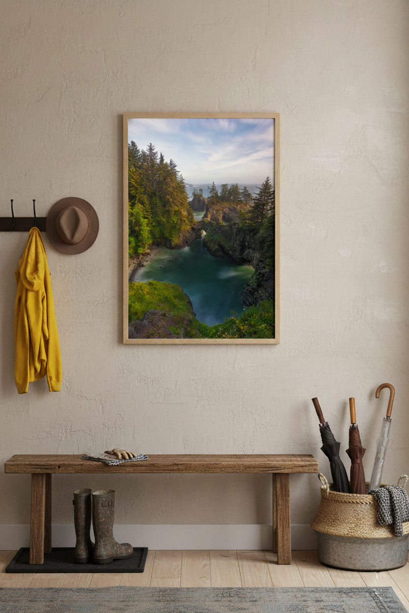 Framed Natural Bridges fine art photo hanging above a wooden bench in a cozy mudroom entryway with rain gear.