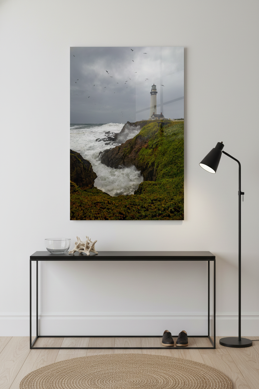 Large frameless Pigeon Point Lighthouse acrylic print displayed above a sleek black console table and floor lamp.