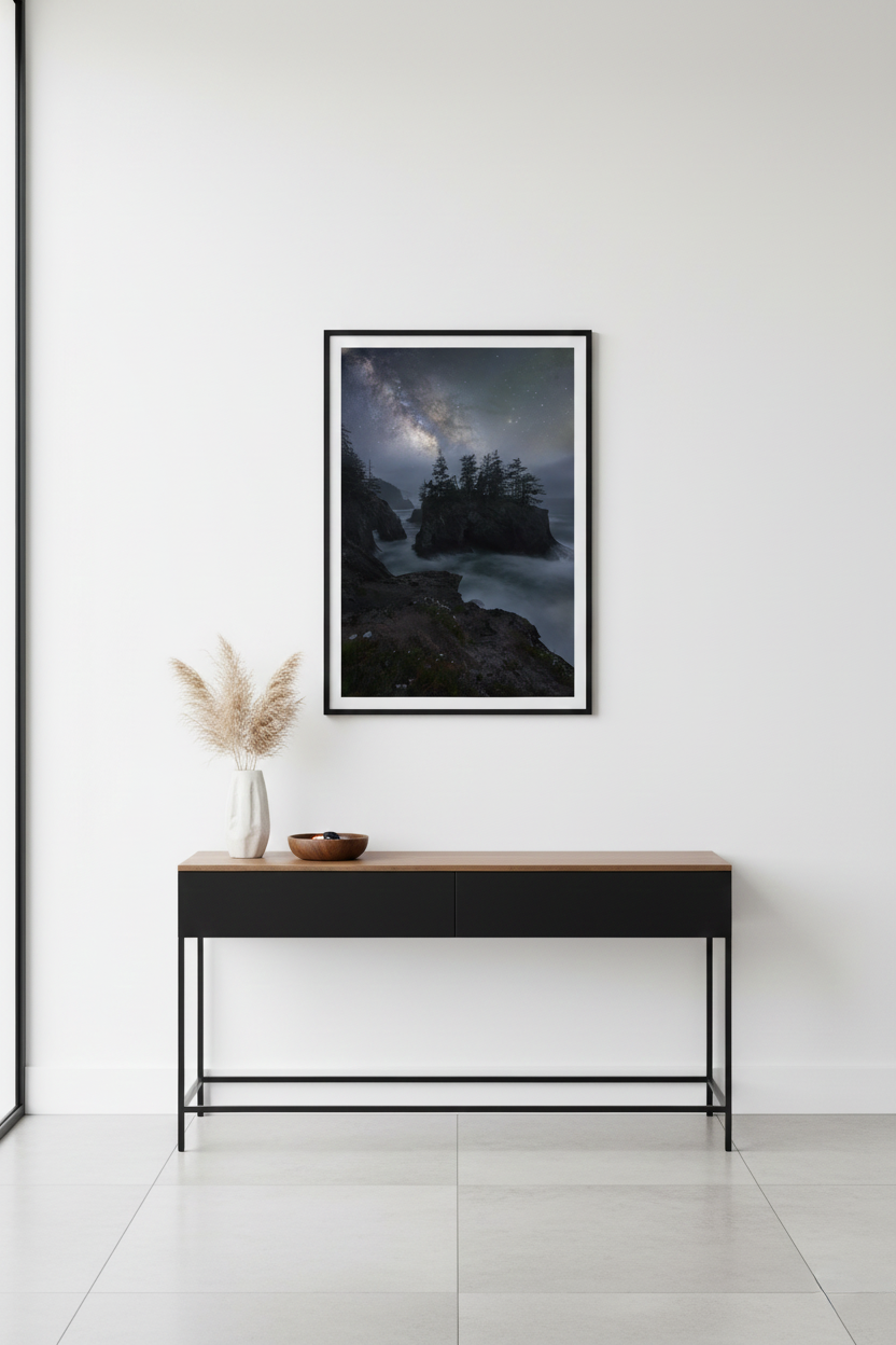 Vertical fine art astrophotography print displayed above a black modern console table on a clean white wall.