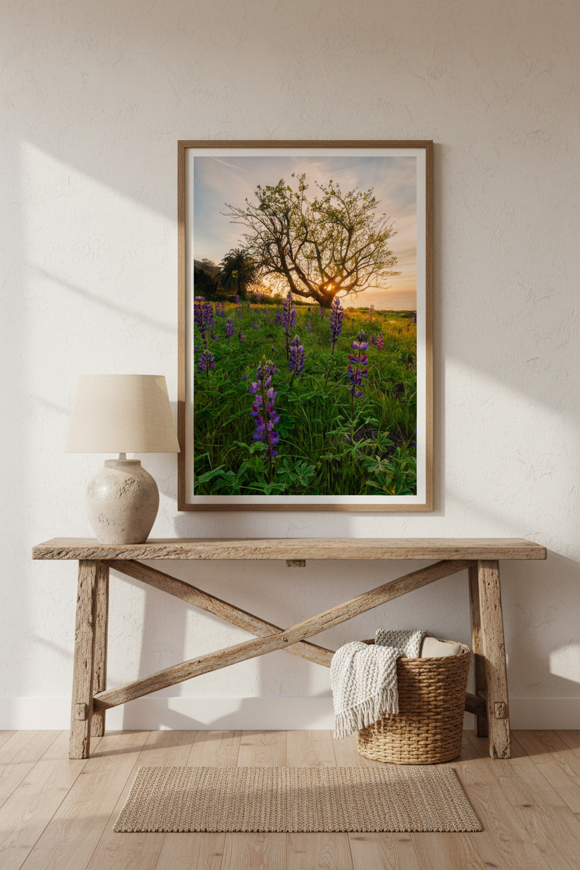 Large framed fine art wildflower print mounted on a plaster wall above a reclaimed wood console table with a ceramic lamp.