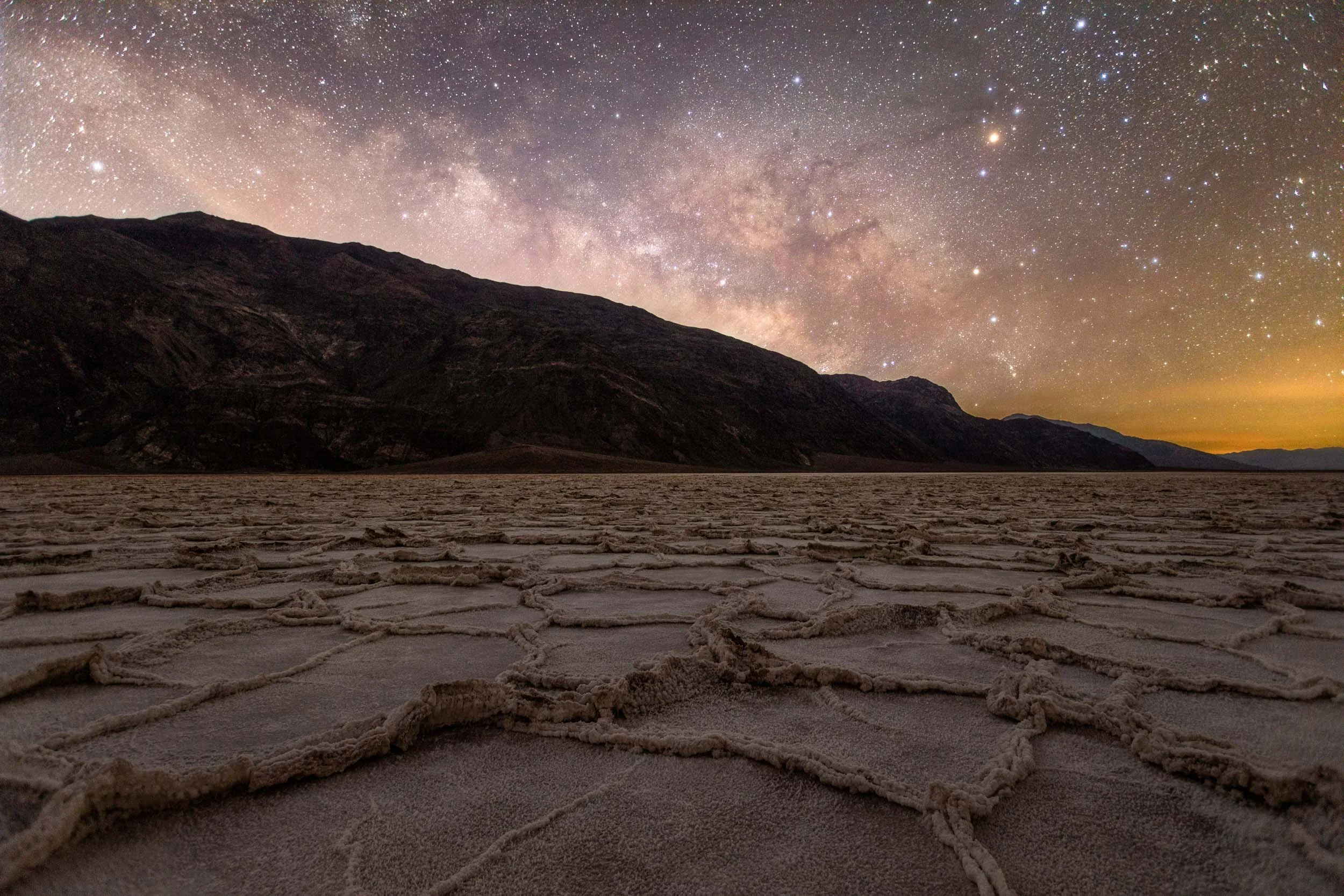 The Milky Way Core Rising over the hexagon shapes of Badwater Basin in Death Valley National Park.
