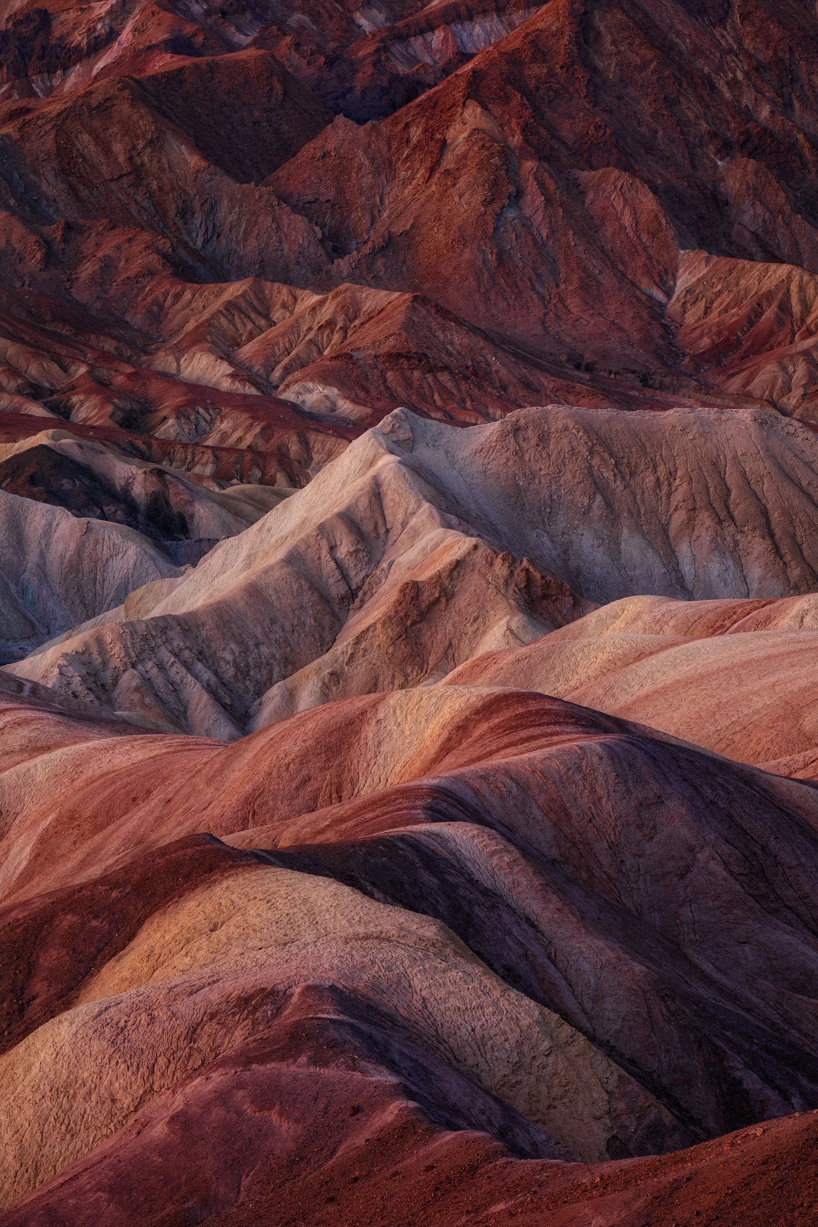 Dramatic compression of the badlands of Death Valley National Park Zabriskie Point