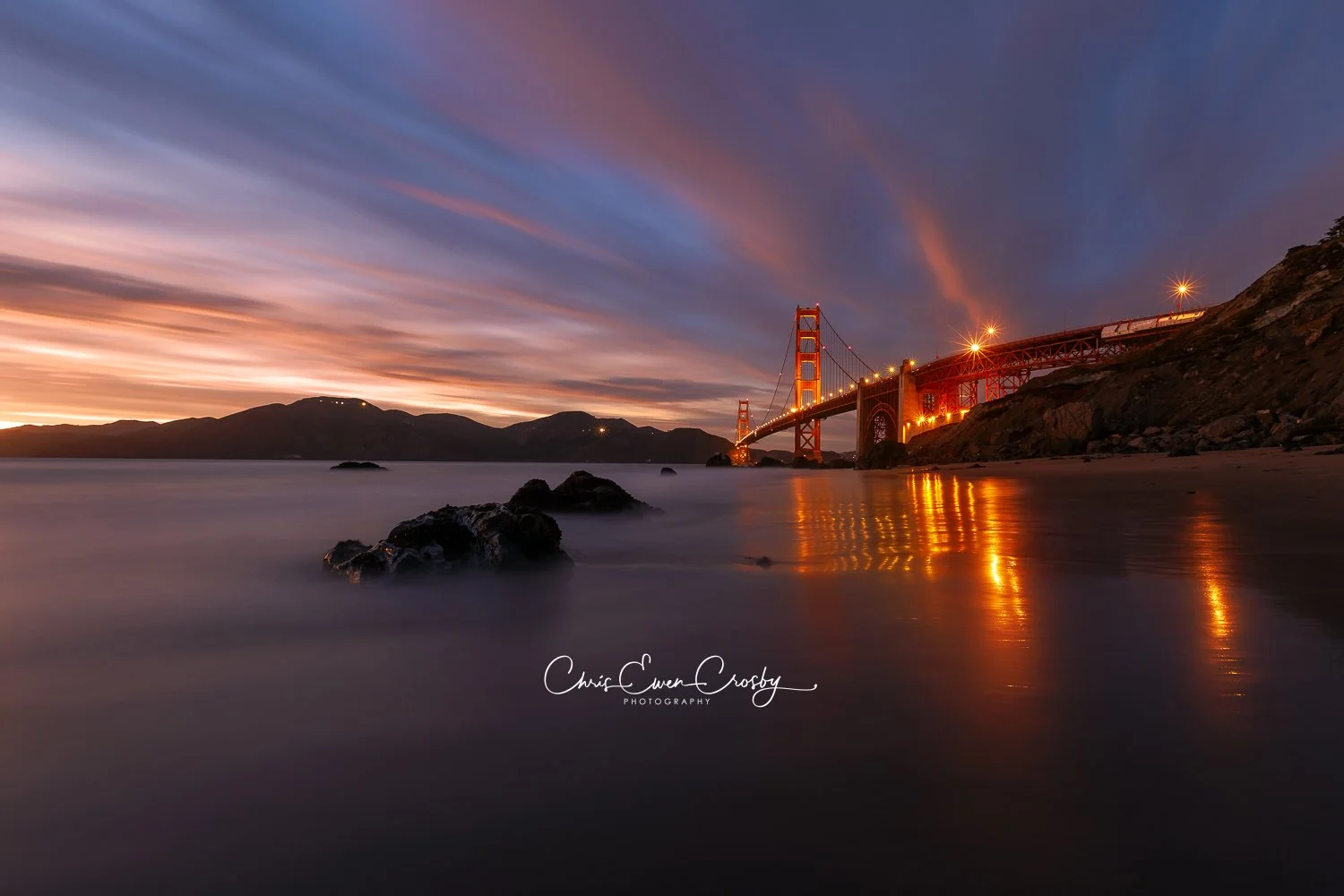Horizontal 3:2 landscape of the Golden Gate Bridge in San Francisco under a vibrant pink and orange dusk sky.