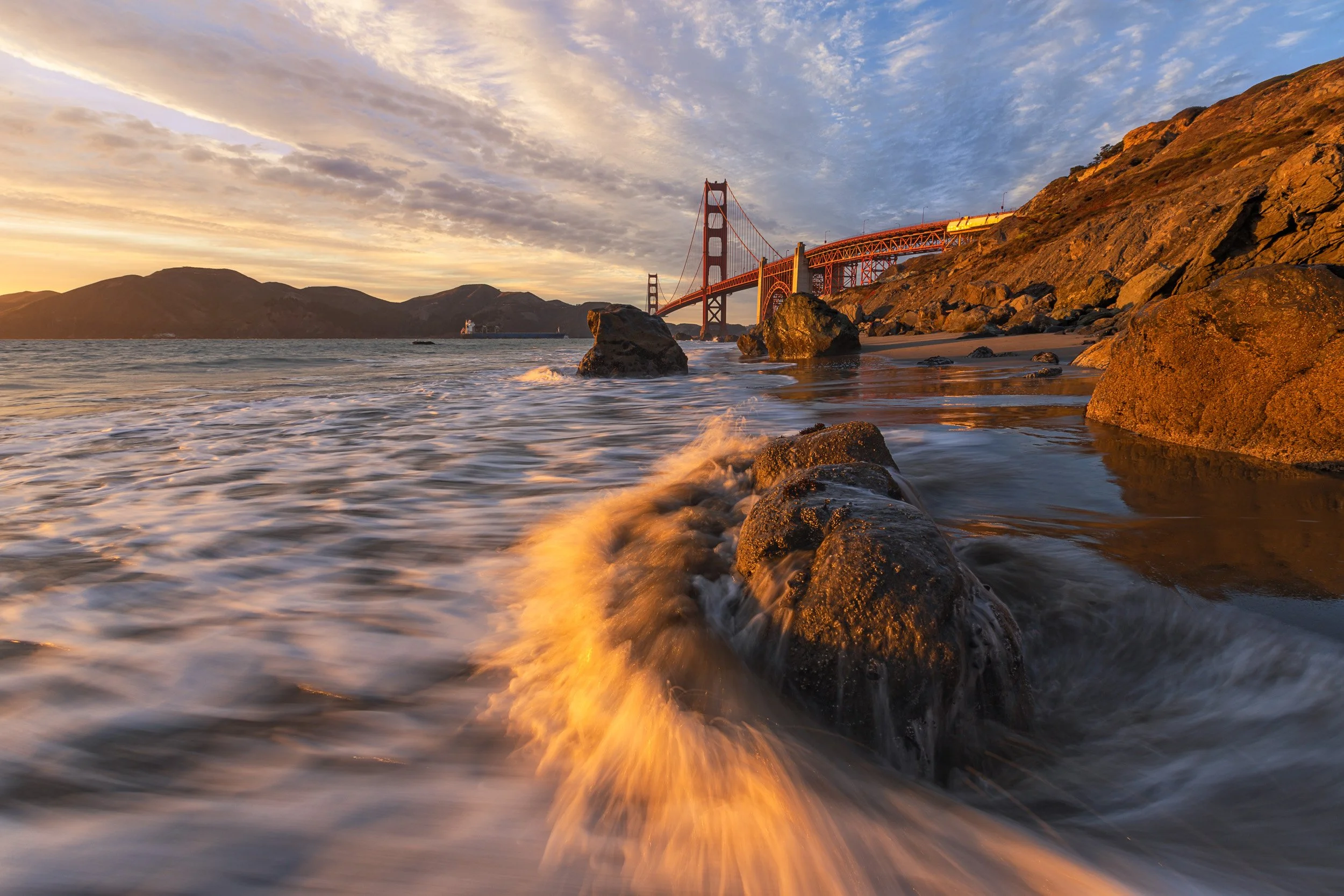 Sunset view of Golden Gate Bridge from Marshall's Beach, San Francisco, California