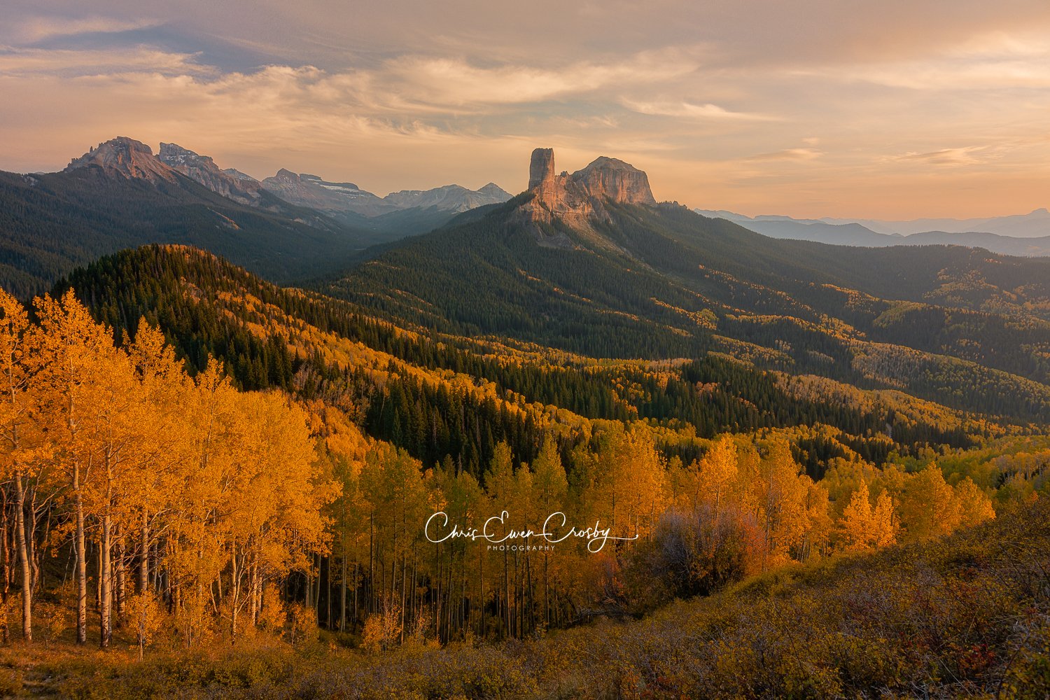 San Juan Mountains Colorado sunset; 3:2 landscape photo of a mountain ridge with fall colors and dappled light.