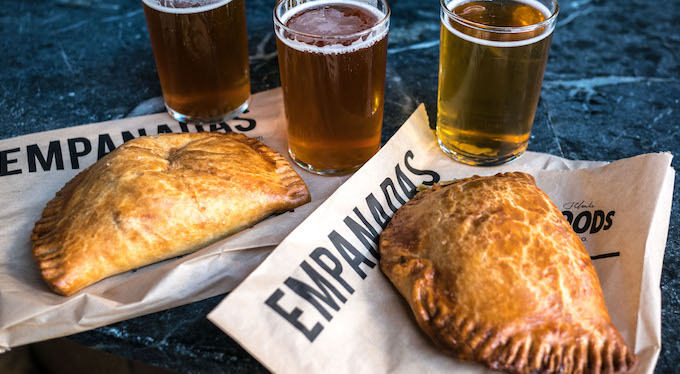 The perfect pairing: A flight from the Wood Brewery crew and empanadas courtesy of El Porteno.