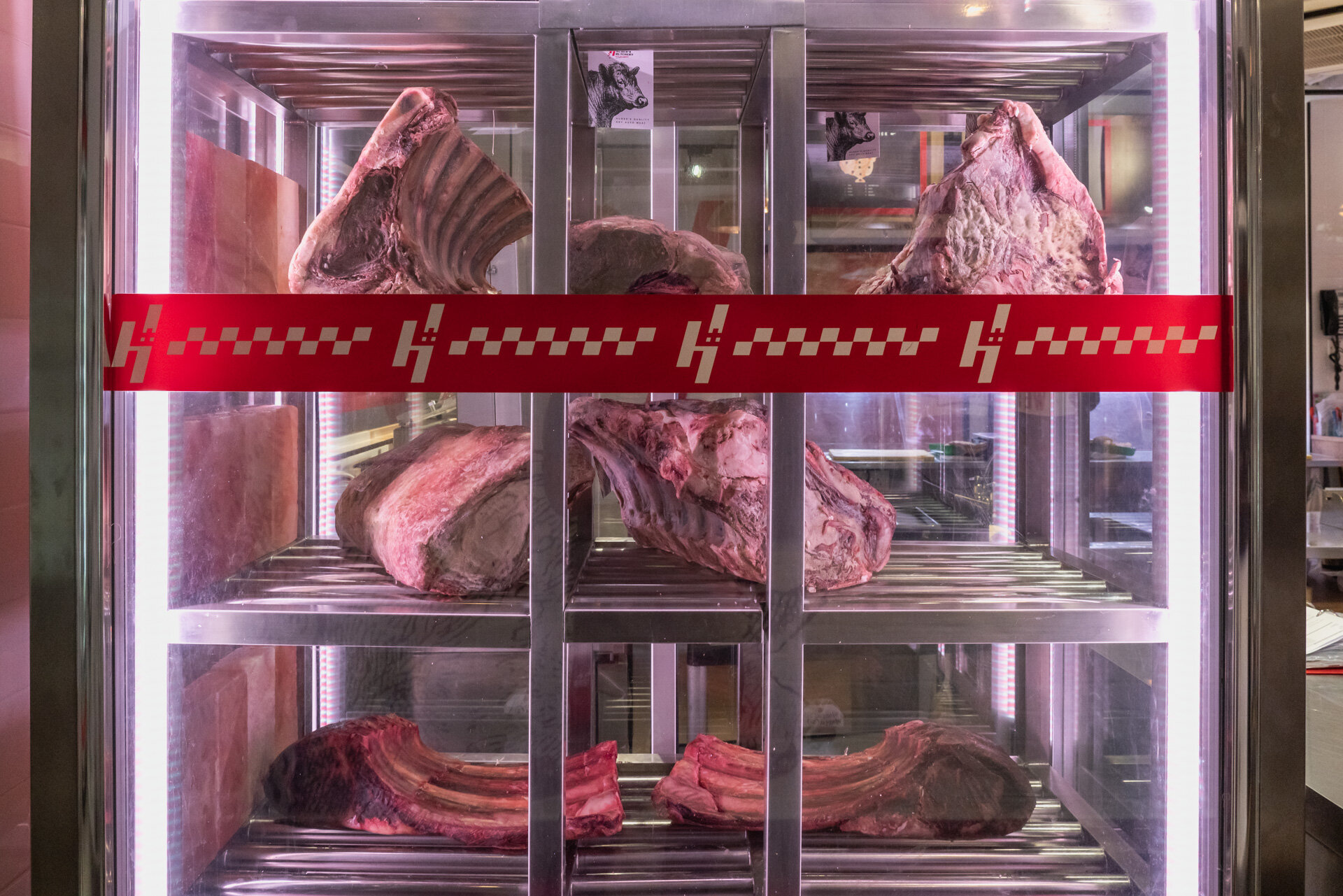 kitchen shelf containing racks of meat