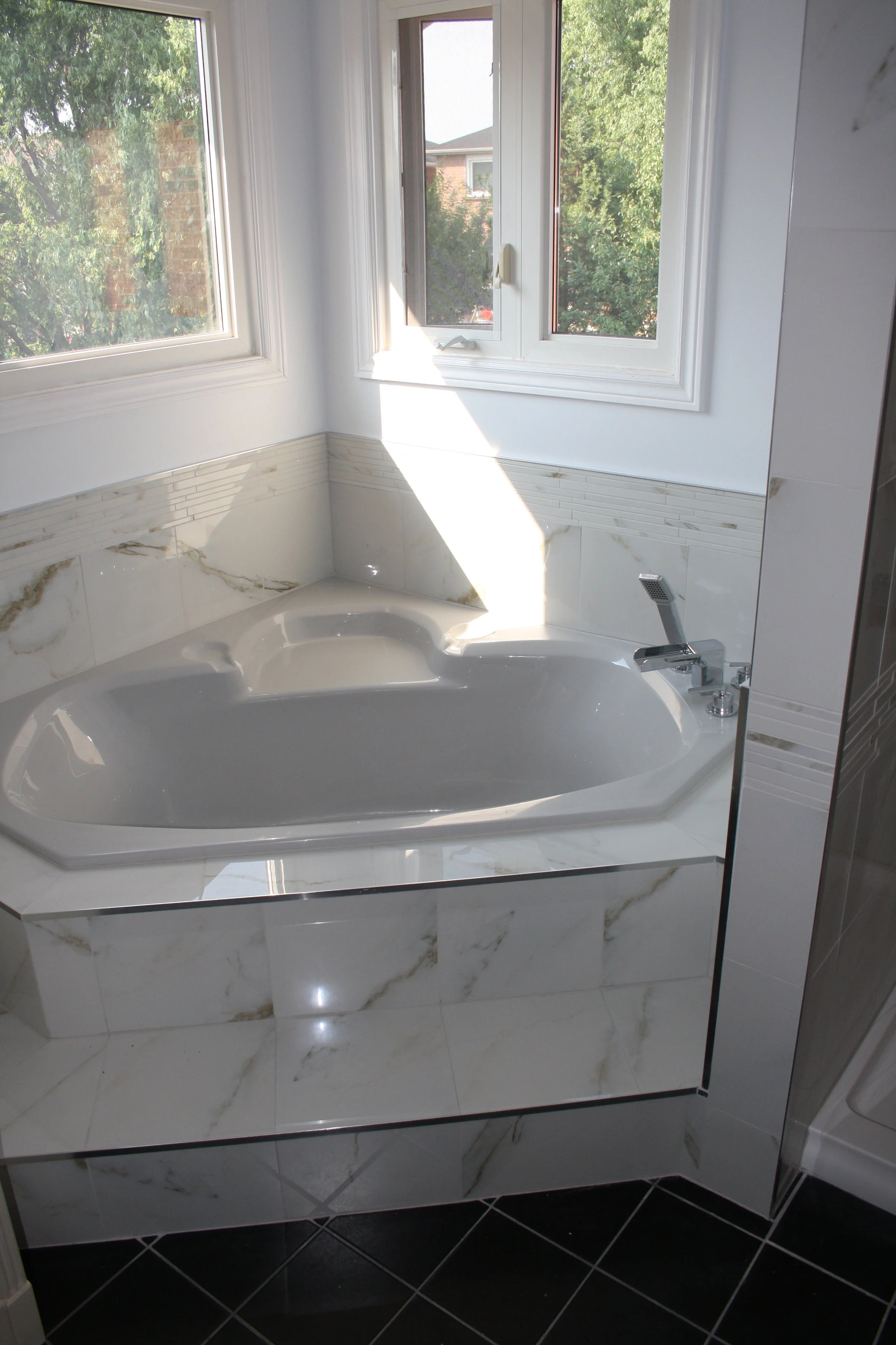 Complete retiling with metal finishing edges. Over 300 cuts.